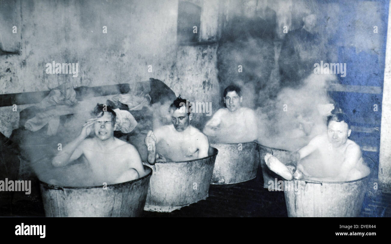 British soldiers from the Dorset shire regiment bath in metal tubs, England, World War Two. Stock Photo