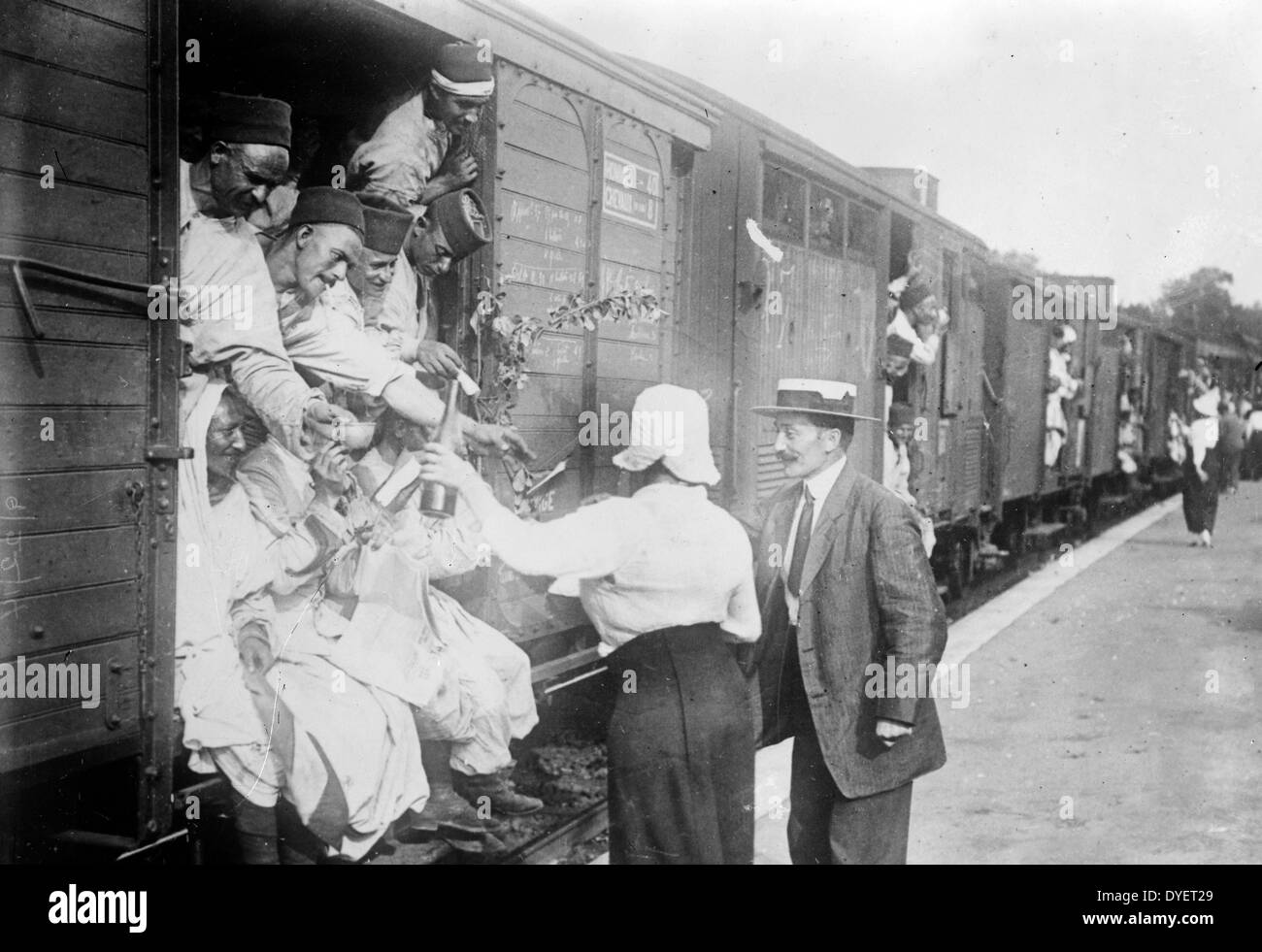 Photograph shows people giving wine to Algerian soldiers at Champigny-sur-Marne, France, during World War I. Stock Photo