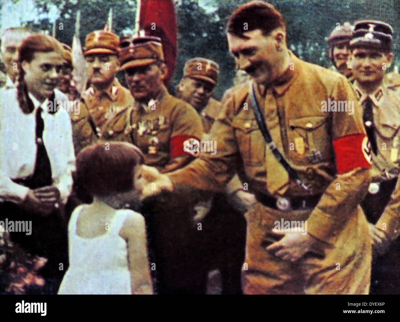 Hitler with adoring supporters. These photographs were taken to enhance the father of the nation status of Adolf Hitler after he became Chancellor of Germany in 1933.Rudolf Hess the Deputy Fuhrer is shown on theright. Stock Photo