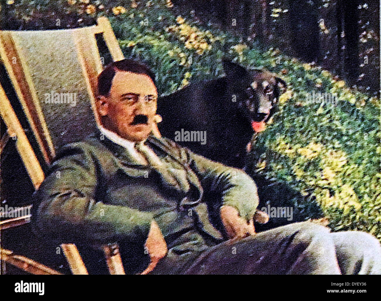 Hitler on vacation with a dog seated ajacent to him 1934 Stock Photo