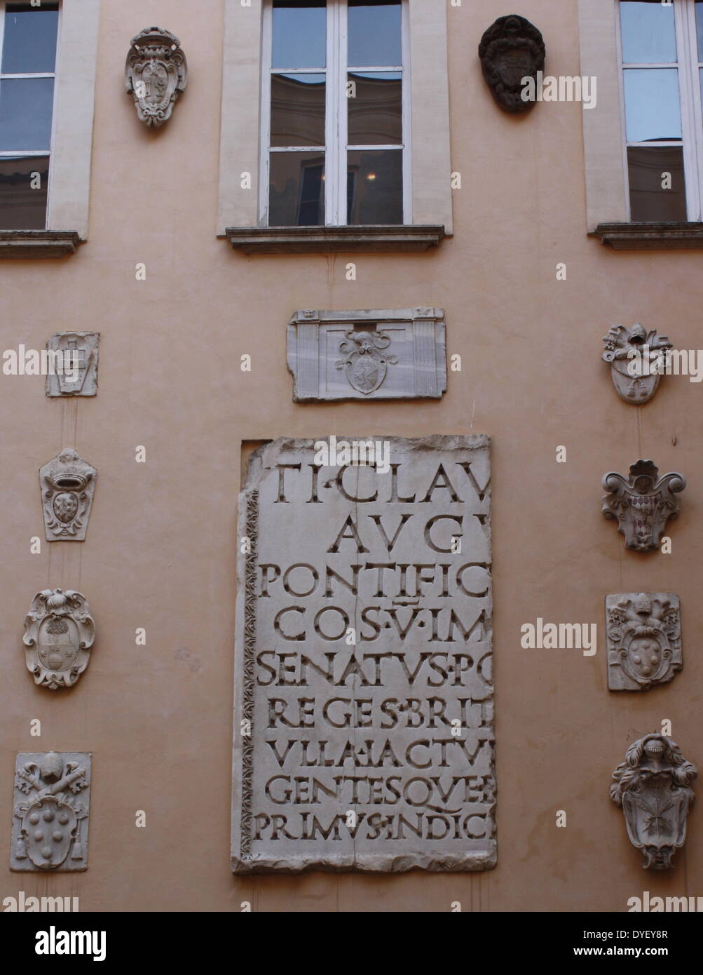 Latin inscription detail from the entrance/courtyard to the Capitolini museums, in Rome, Italy. The museums themselves are contained within 3 palazzi as per designs by Michelangelo Buonarroti in 1536, they were then built over a 400 year period. Stock Photo