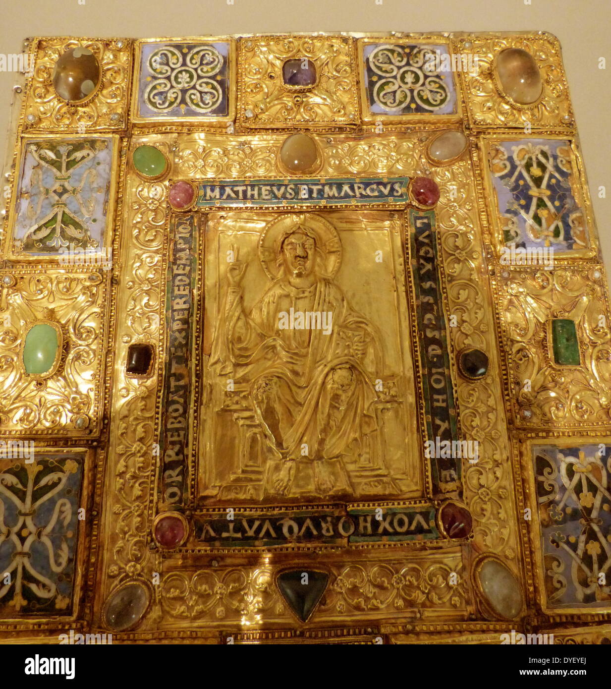 Bejewelled religious plaque with relief image and Latin Inscription. Stock Photo