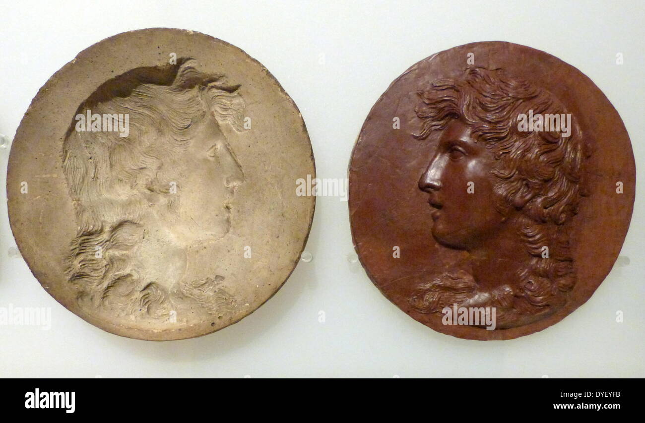 Plaster Mould and Cast of Apollo. Apollo was god of music and enlightenment, and the son of Zeus. The cast's surface is a red composite material. Stock Photo