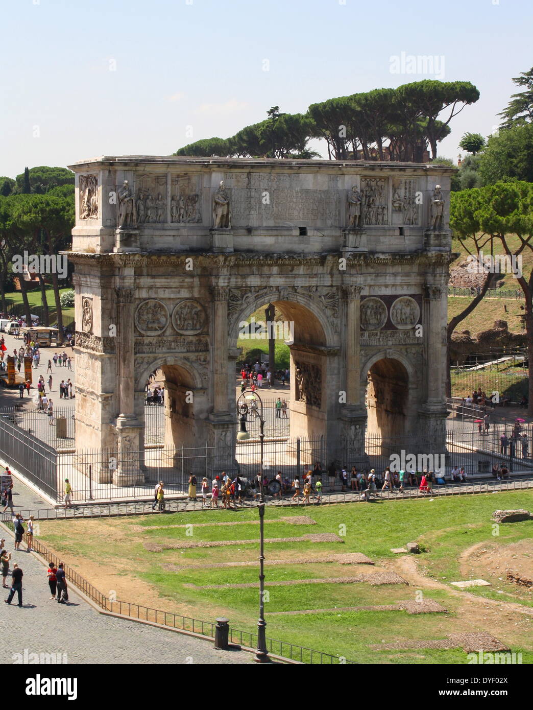 The Arch of Constantine, a triumphal, or victory arch in Rome. It is positioned between the Collosseum and the Palatine Hill. It commemorates Emperor Constantine's victory in the Battle of Milvian Bridge in the early 4th century AD. It was dedicated in 315 AD and features reliefs/friezes documenting previous Emperors and victory figures. Stock Photo