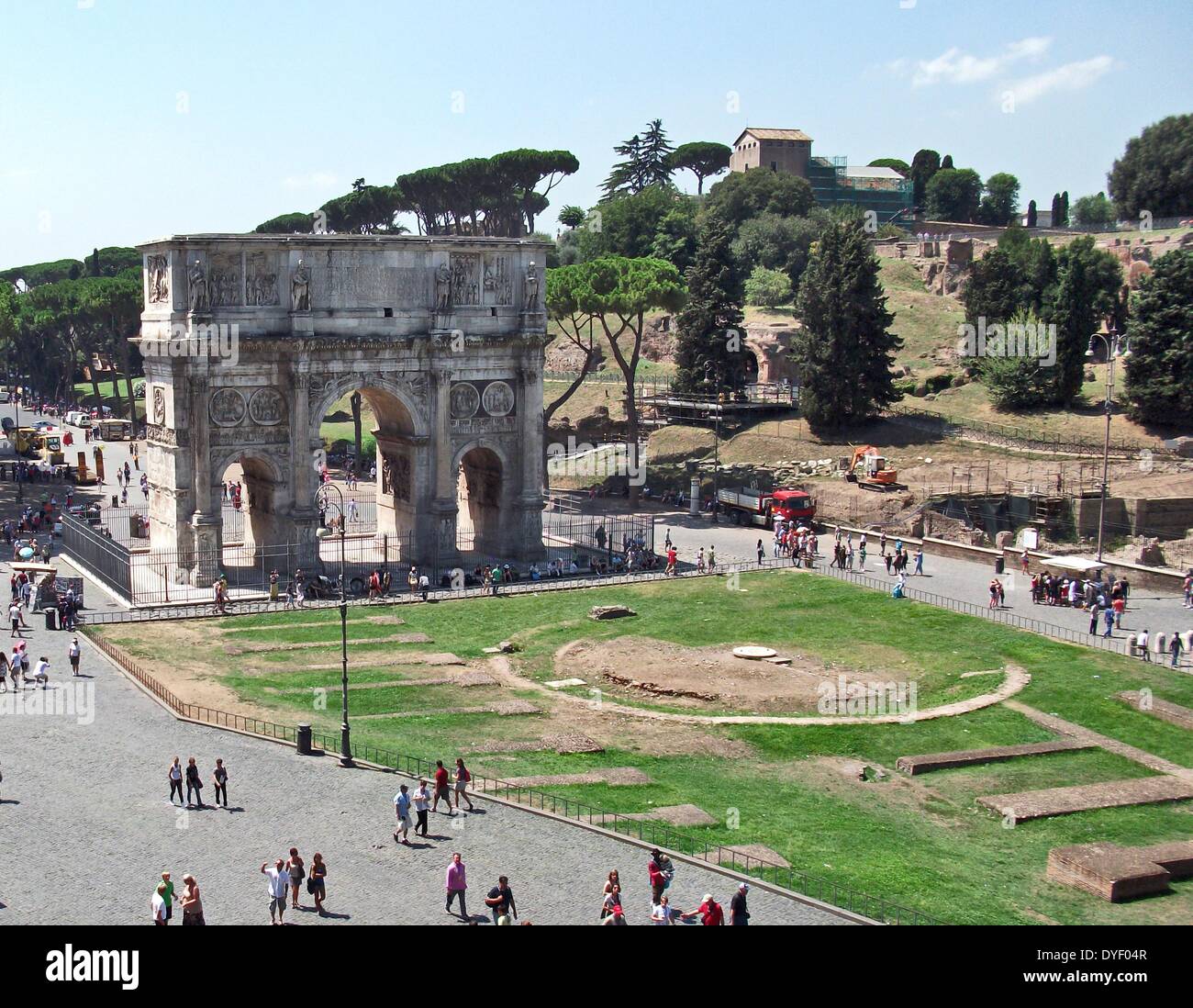 The Arch of Constantine, a triumphal, or victory arch in Rome. It is positioned between the Collosseum and the Palatine Hill. It commemorates Emperor Constantine's victory in the Battle of Milvian Bridge in the early 4th century AD. It was dedicated in 315 AD and features reliefs/friezes documenting previous Emperors and victory figures. Stock Photo