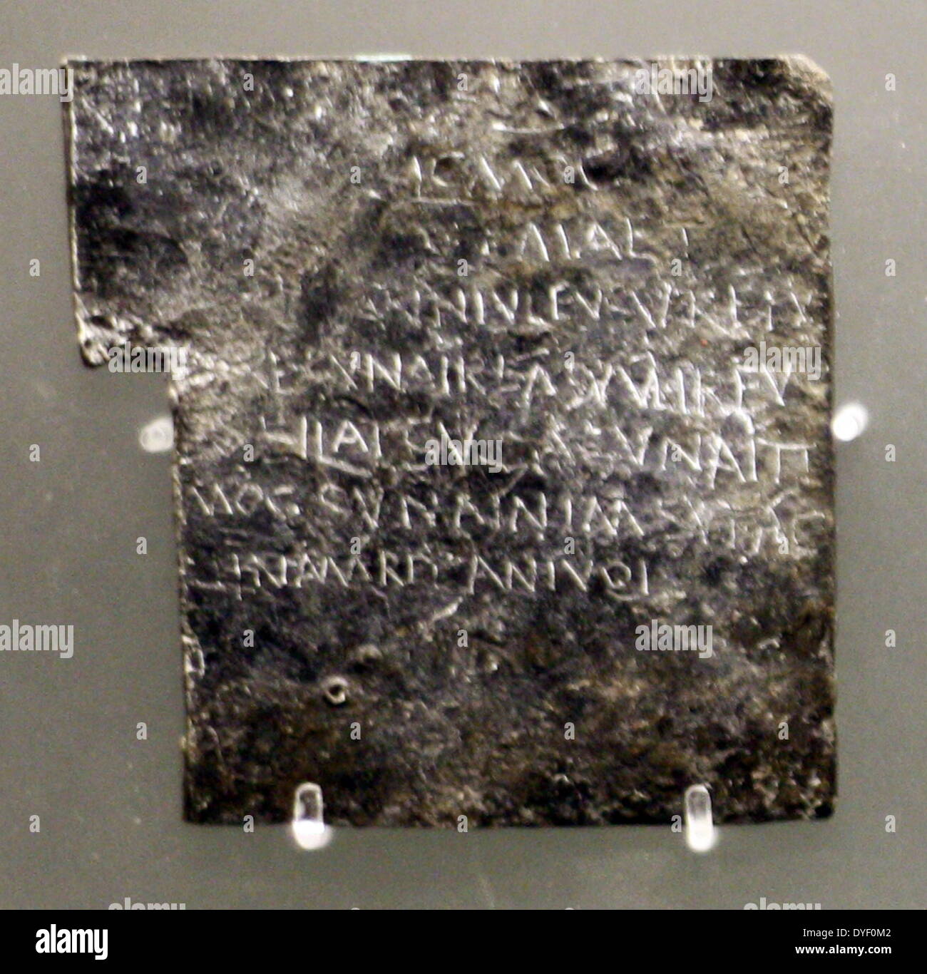 Text scratched into metal complaining of the theft of 'Vilbia' (Thought to be a woman, possibly a slave). Known as a 'curse' this text lists possible culprits by name. Circa 1st-3rd century AD. Stock Photo