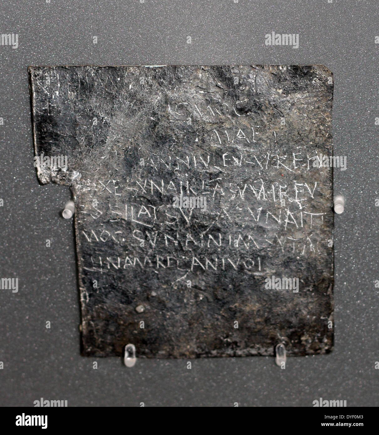 Text scratched into metal complaining of the theft of 'Vilbia' (Thought to be a woman, possibly a slave). Known as a 'curse' this text lists possible culprits by name. Circa 1st-3rd century AD. Stock Photo