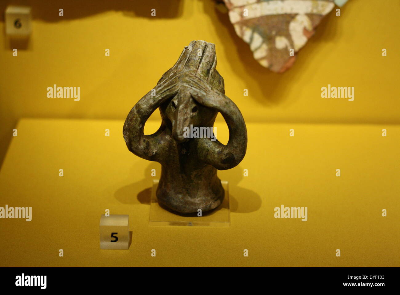 Roof adornment (finial) made from fired clay. Circa 13th-14th century. The figure is in the form of an imaginary animal. Stock Photo