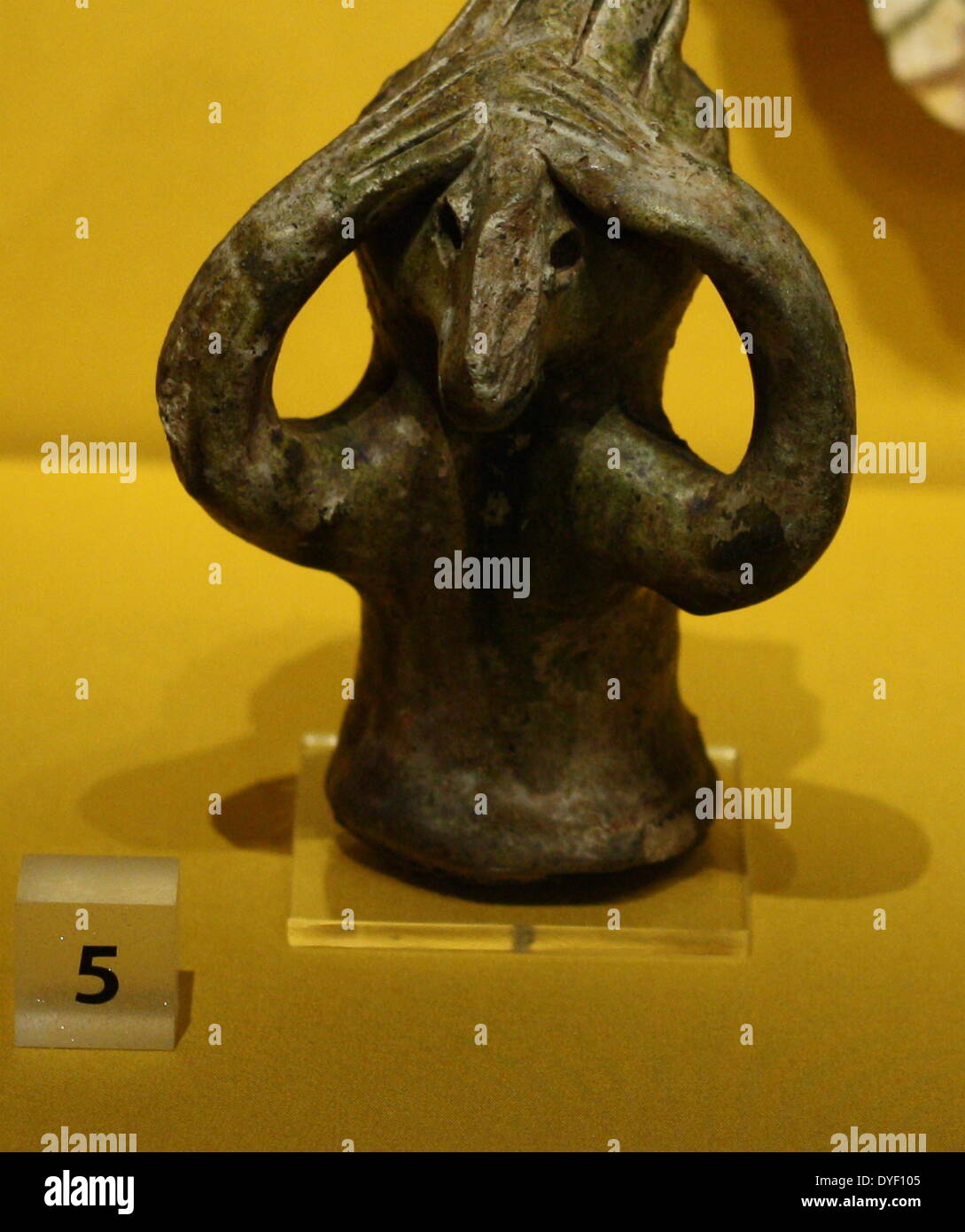 Roof adornment (finial) made from fired clay. Circa 13th-14th century. The figure is in the form of an imaginary animal. Stock Photo