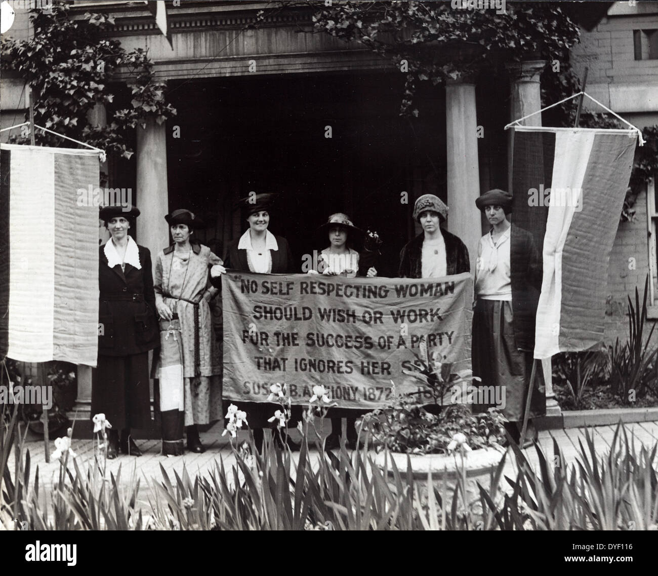 Photograph of six suffragists at the 1920 Republican National Convention in Chicago, gathered in front of a building with suffrage banners. Mrs. James Rector, Mary Dubrow, and Alice Paul (left to right) hold centre banner that reads: 'No self respecting woman should wish or work for the success of a party that ignores her self. Susan B. Anthony, 1872.' Stock Photo
