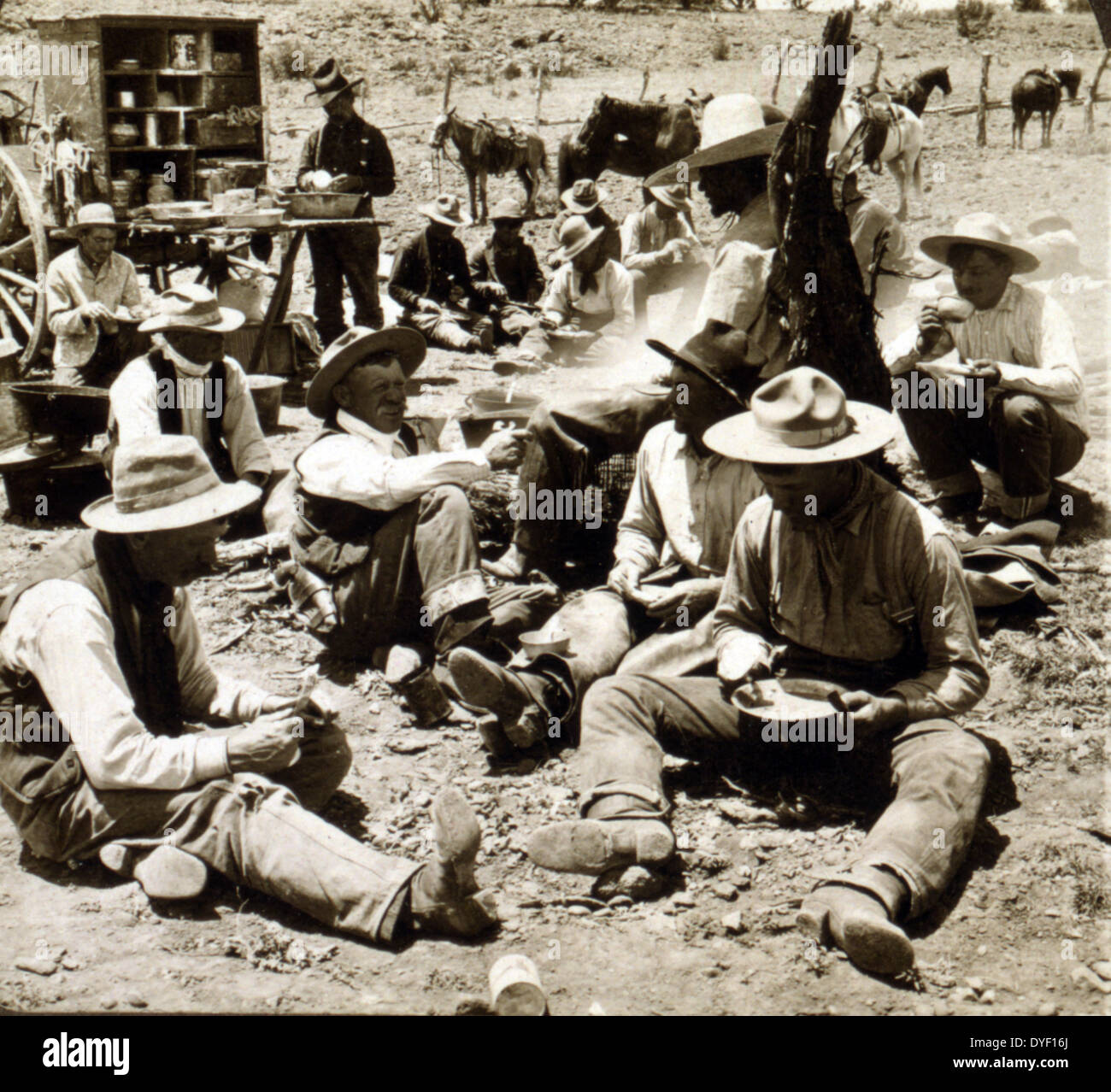 Cowboys at dinner. Scene at noon hour in a typical cowboy camp of the