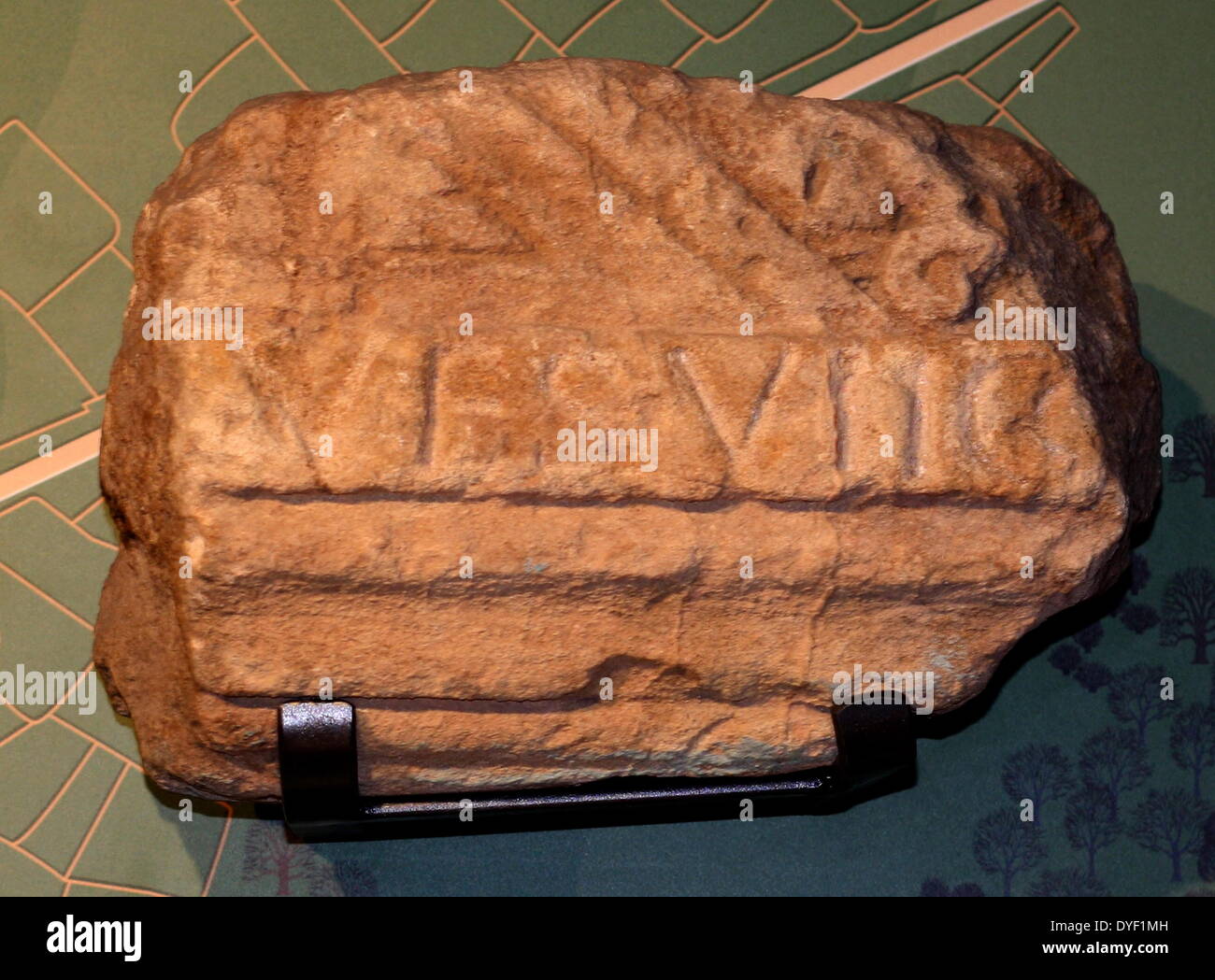 A wall fragment featuring inscription from the Roman baths. The oldest inscription found, it reads 'In the 7th consulship of the emperor Vespasian'. This helps date this part of the baths at seven years after he became Emperor in 69 AD. Stock Photo