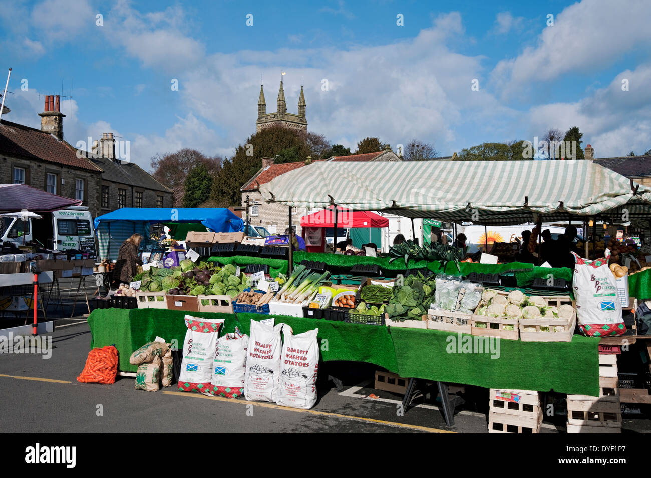 Outdoor market stall displaying fresh produce vegetables Market Place Helmsley North Yorkshire