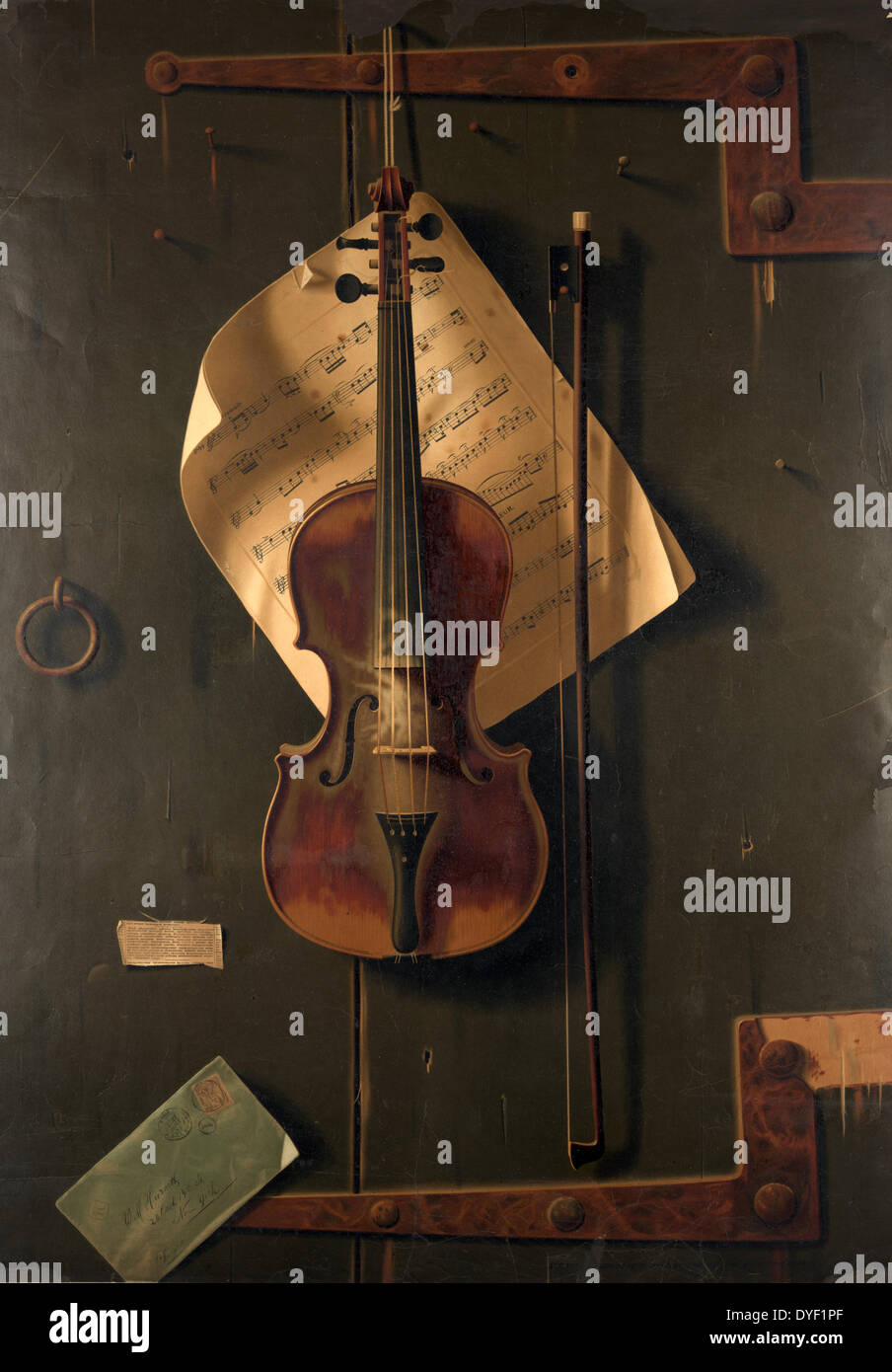 The Old Violin by F. Tuchfarber of Cincinnati in 1887, is a highly decorative subject with it's tromp l'oeil subject of a violin backed by sheet music. The violin is artfully arranged with a bow and letter. The top and bottom have iron hinges which have been incorporated into the trompe l’oeil frame Stock Photo