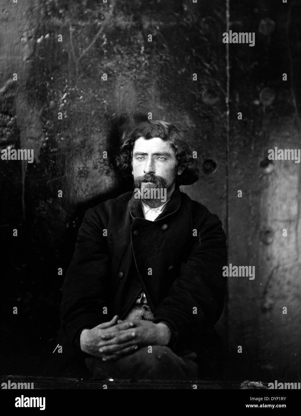 Washington Navy Yard, D.C. Unidentified man, arrested on suspicion of being a conspirator (has been erroneously taken for Dr. Samuel A. Mudd, who had a bald forehead; but is probably Hartman Richter, Atzerodt's cousin, arrested with him but later released 1865. Photograph of Washington, 1862-1865, the assassination of President Lincoln, April-July 1865. This photograph has background of dark metal, and was presumably taken on the monitors, U.S.S. Montauk and Saugus, where the conspirators were for a time confined. Stock Photo