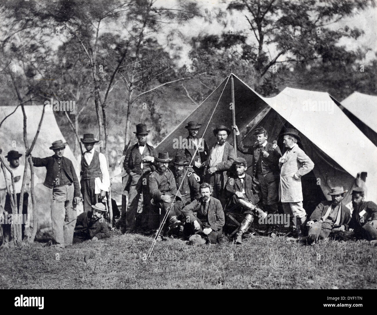 Incidents of the war, group at Secret Service Department Headquarters, Army of the Potomac, Antietam, October 1862. Photograph shows fourteen men, including Allan and William Pinkerton, and several Union Army officers posed in front of a tent. Stock Photo