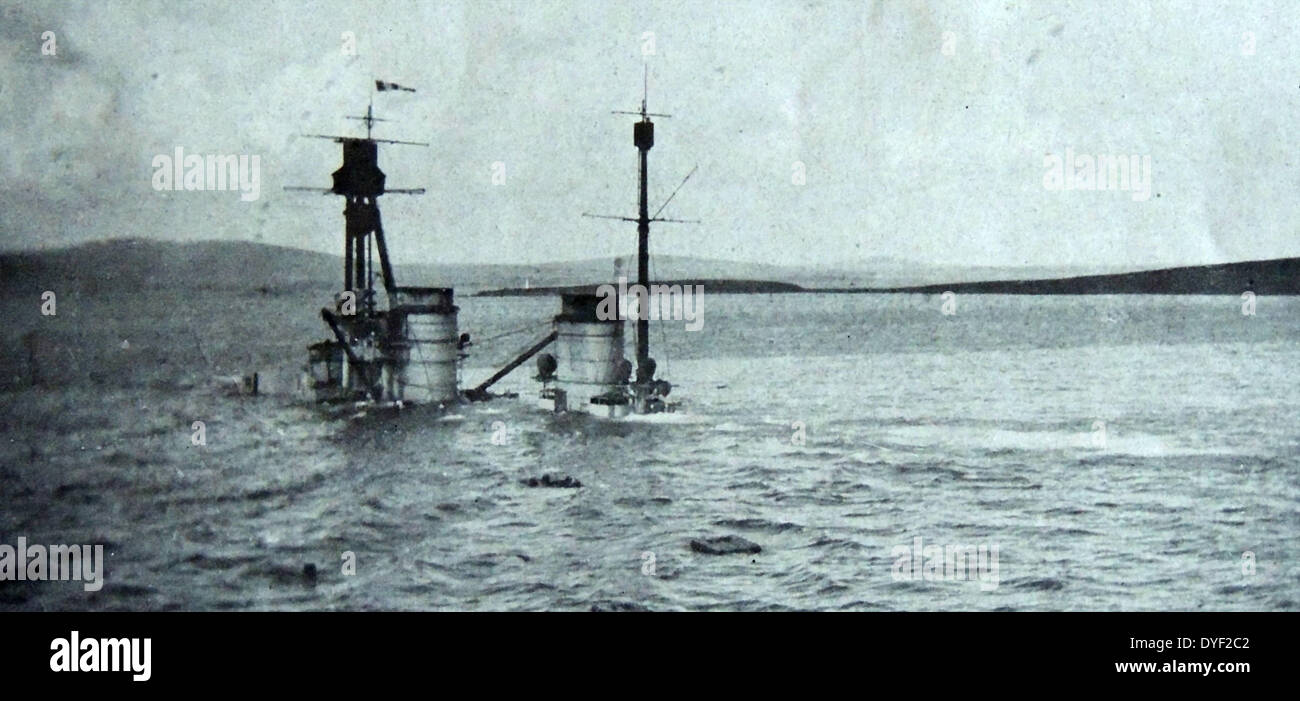Following the German defeat in WWI, 74 ships of the Kaiserliche Marine's High Seas Fleet were interned in Gutter Sound at Scapa Flow pending a decision on their future in the peace Treaty of Versailles. On 21 June 1919, after nine months of waiting, Rear Admiral Ludwig von Reuter, the German officer in command at Scapa Flow, made the decision to scuttle the fleet because the negotiation period for the treaty had lapsed with no word of a settlement 1919 Stock Photo