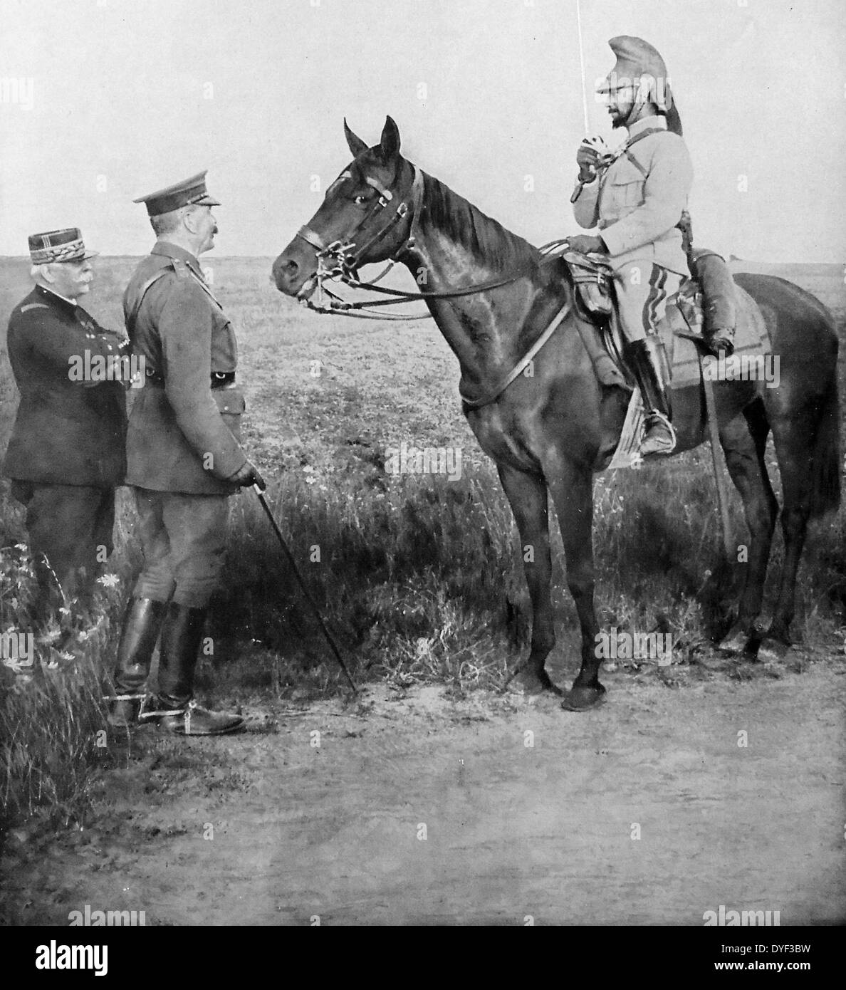 General Joffre and Lord Kitchener meet general Baratier (right, mounted), who salutes with a sword. France 1915 Stock Photo