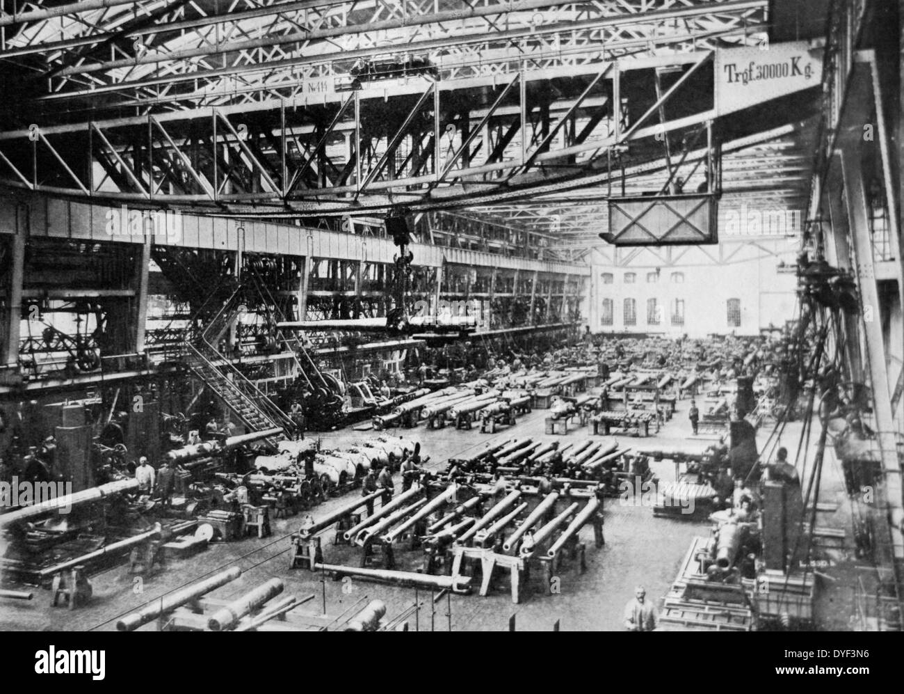 Photo of Krupp works in Germany, showing shop floor workers manufacturing big guns. First World War. Circa 1914. Stock Photo