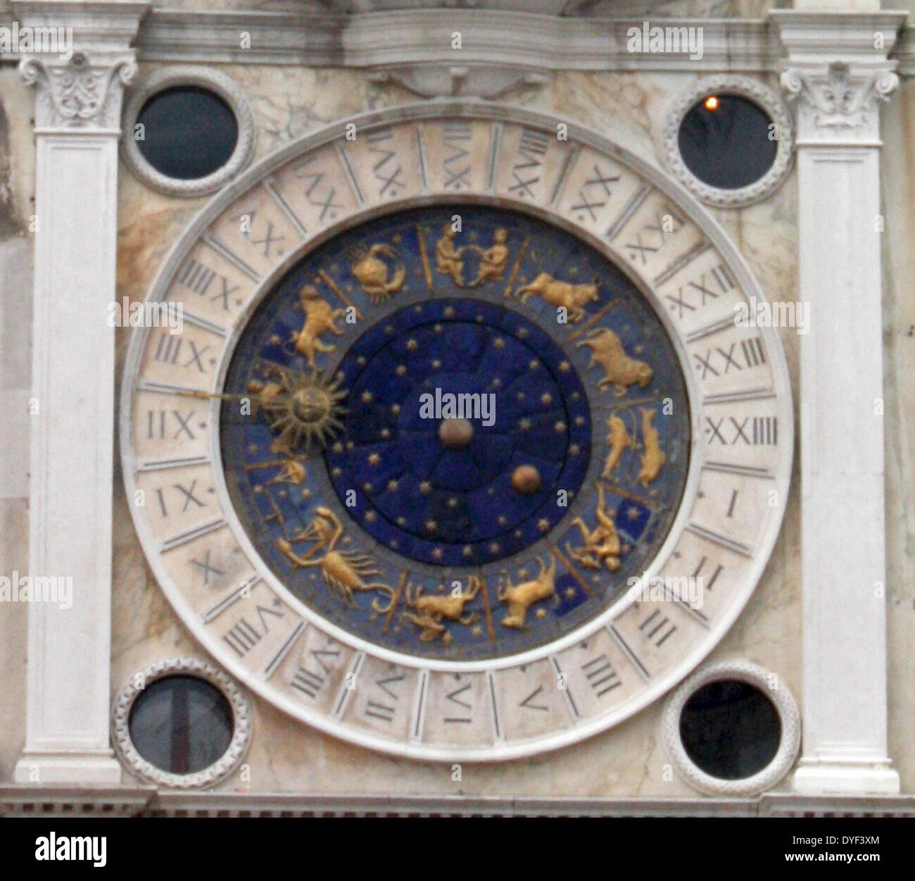 The Clockface of St Mark's Clocktower 2013. Blue and Gold clock face lined with the signs of the Zodiac and Roman Numerals. Stock Photo