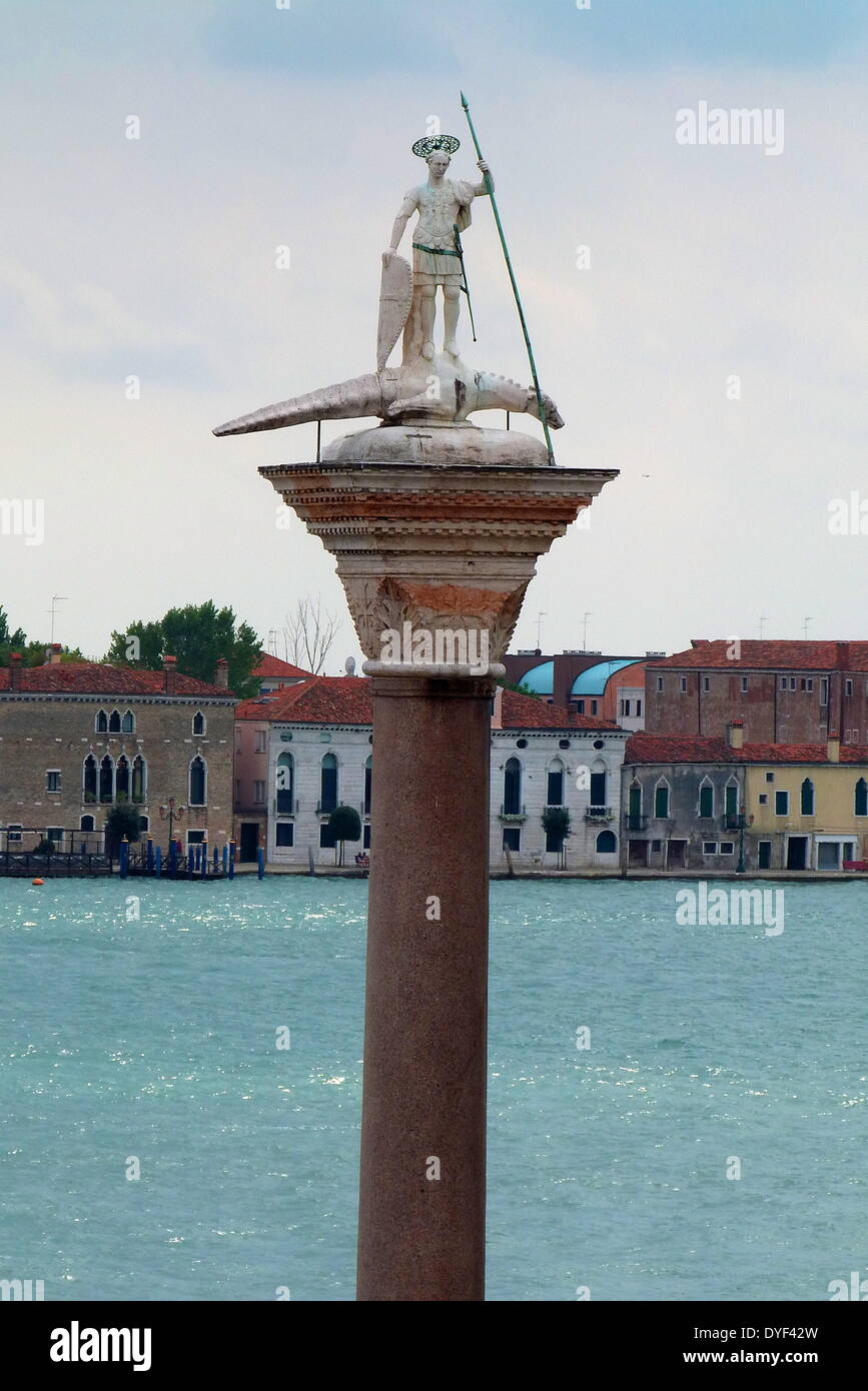 St Theodore on Column in the Piazza San Marco 2013. St. Theodore is seen here standing apon a dragon with a spear in one hand and his shield in the other. Stock Photo