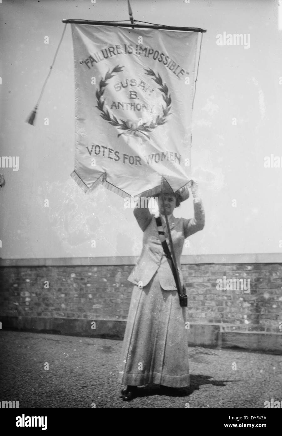 Failure Is Impossible. Susan B. Anthony. Votes for Women 1913. Photo shows suffragist Florence Jaffray 'Daisy' Harriman  holding a banner with the words 'Failure Is Impossible. Susan B. Anthony. Votes for Women' Stock Photo