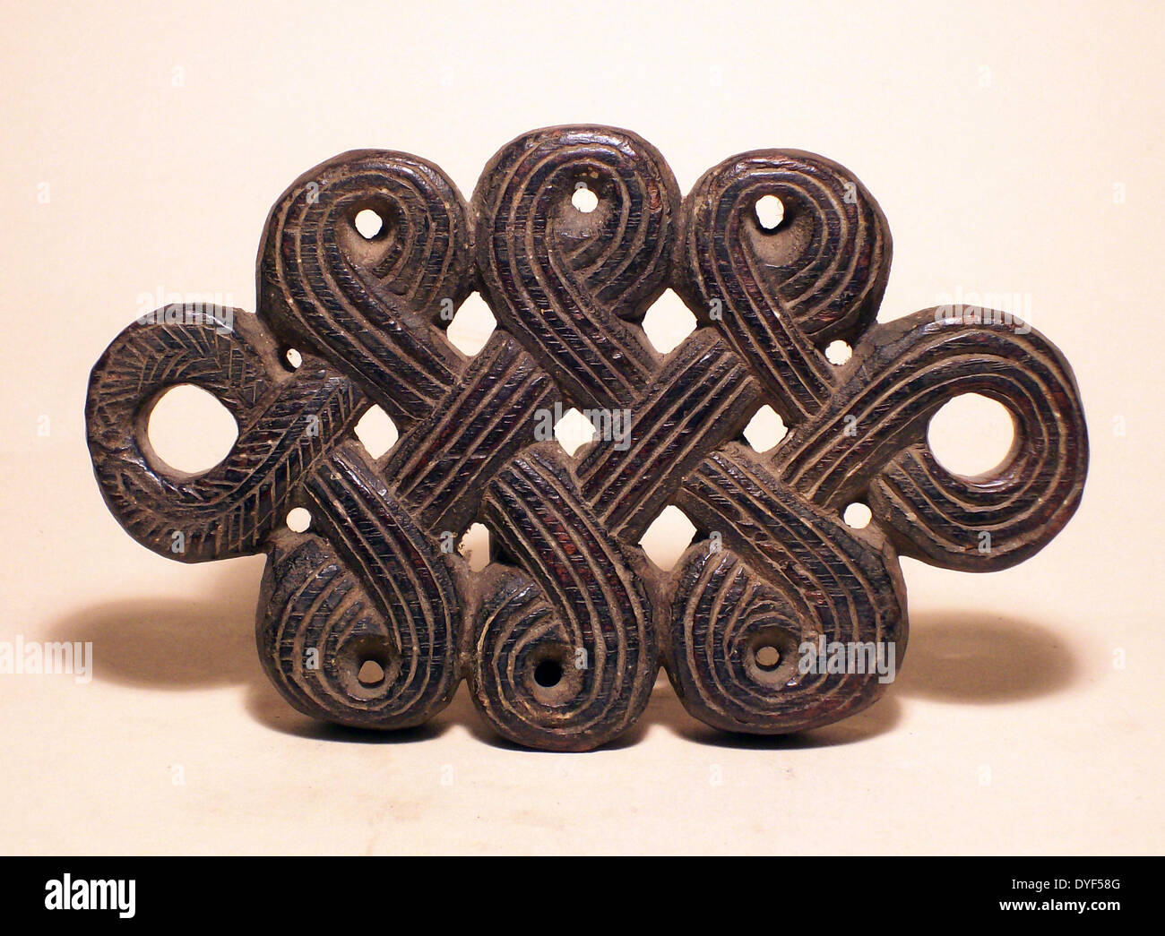 Endless Knot, from Nepal, where it is displayed as a protection against ill-health and death, as it has no beginning and no ending. It is one of the Eught Lkucky Things, or Eight Glorious Synbols of Buddhism. Also known as the Eternal Knot or the Everlasting Knot., it is said to embody a spiritual eternity. Stock Photo