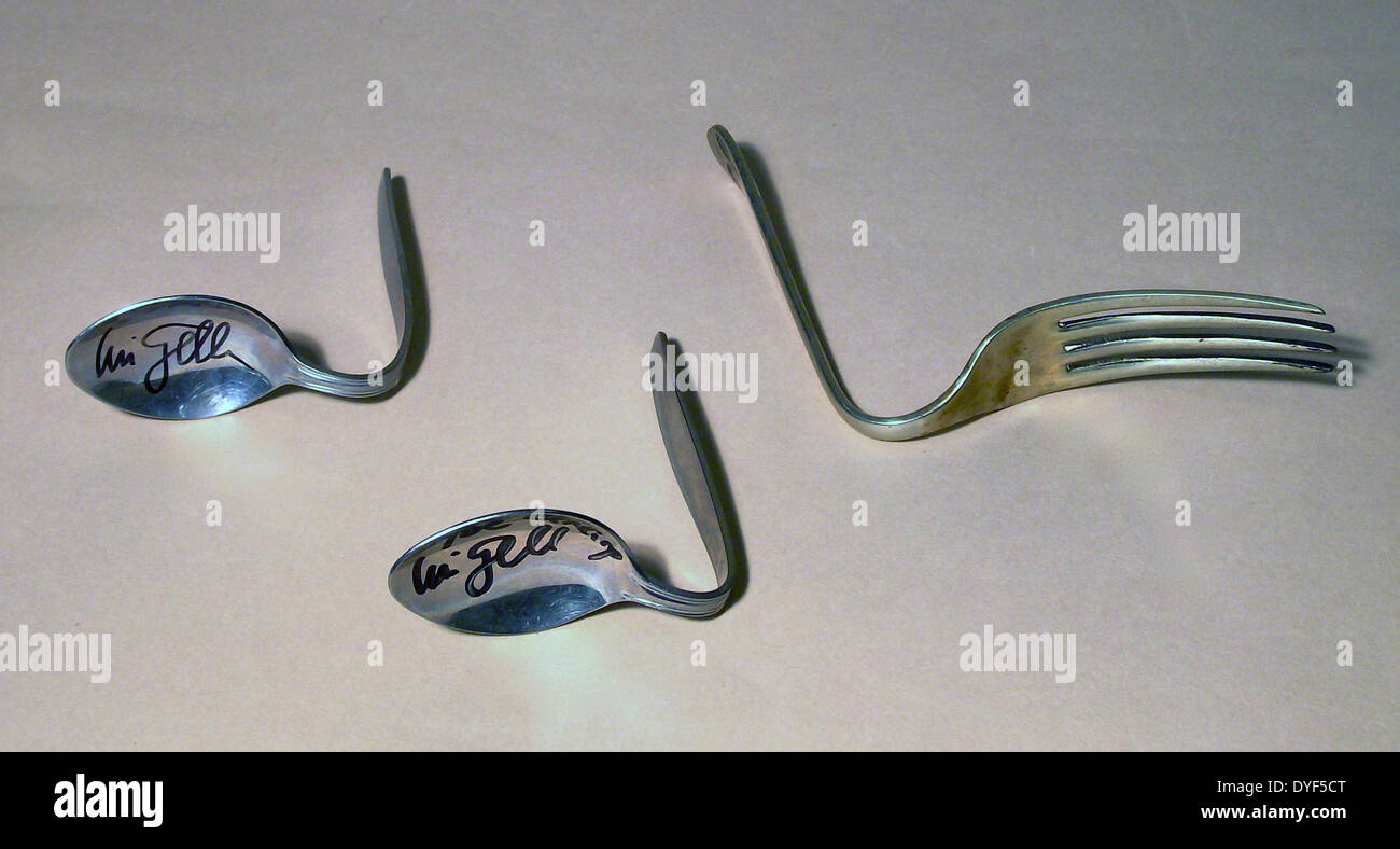 Bent spoons and fork. Left to right Spoon bent by Uri Geller in Stock