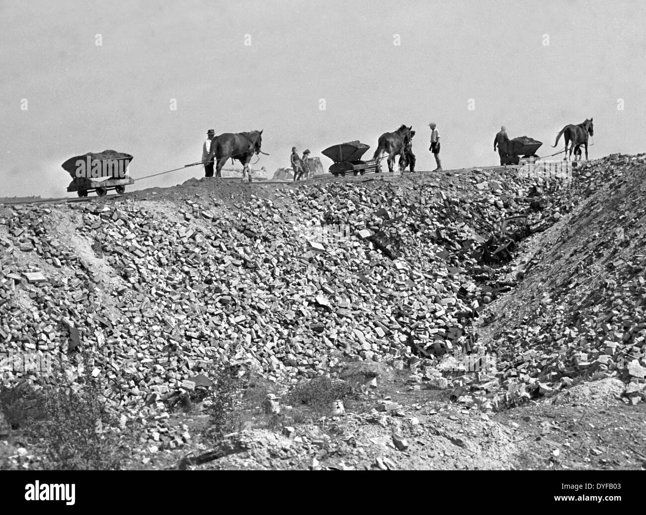 Workers transporting rubble to the destroyed public park Humboldthain in Berlin, 1948. Stock Photo
