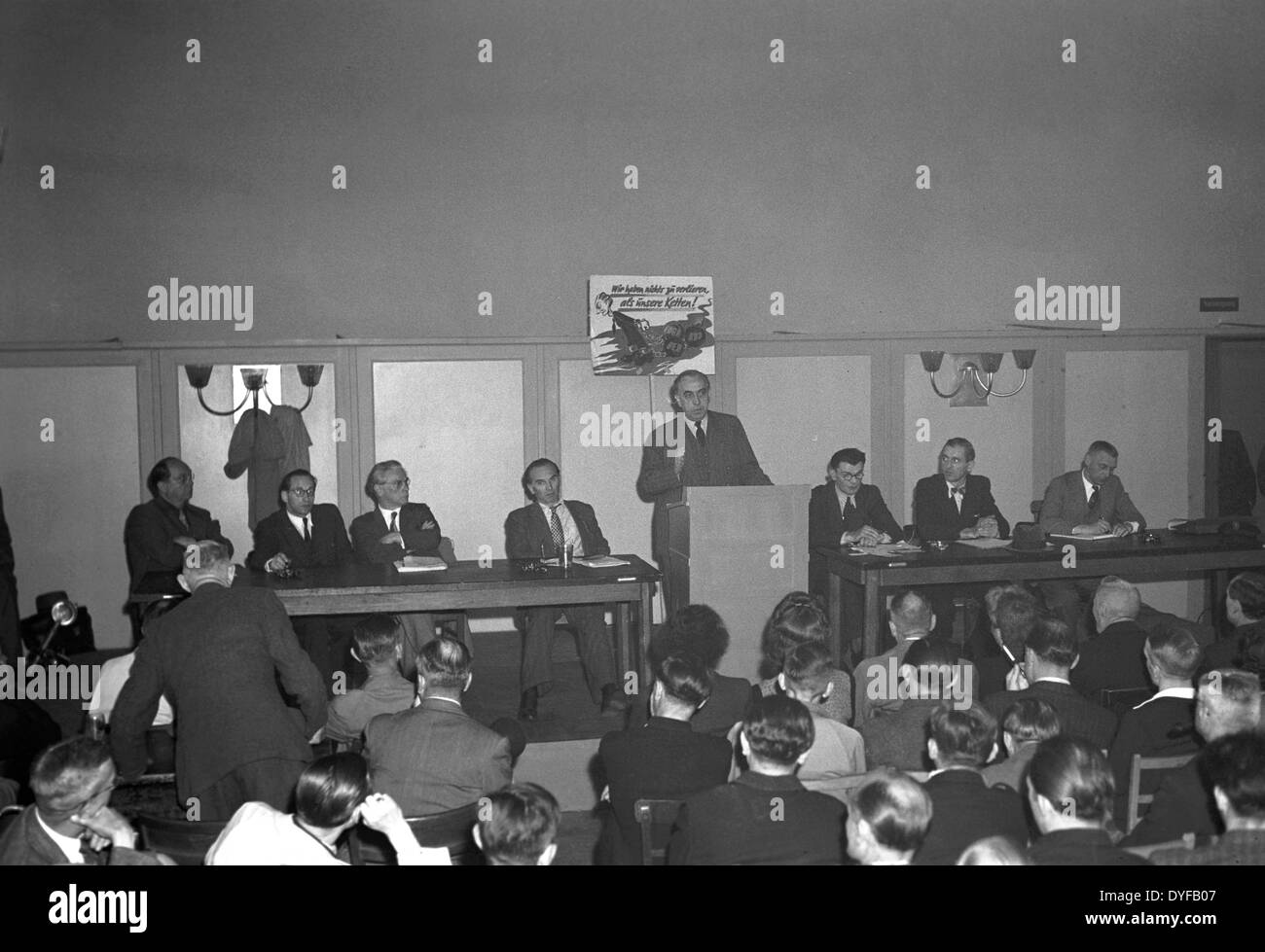 The Mayor of East Berlin, Ernst Reuter, tries to mediate between the Unabhängige Gewerkschaftsopposition (UGO) and the East German State Railway - here he talks to officials of the UGO. The whole railway operations and infrastructure of Berlin were subordinated to the East German State Railway (Deutsche Reichsbahn, DR) of the Soviet zone of occupation until 1949. On 21 May 1949, the Unabhängige Gewerkschaftsopposition UGO in the West sectors called upon to strike. Around 13.000 Reichsbahner (workers of the East German State Railway) living in West Berlin stopped work and fought for a payment i Stock Photo