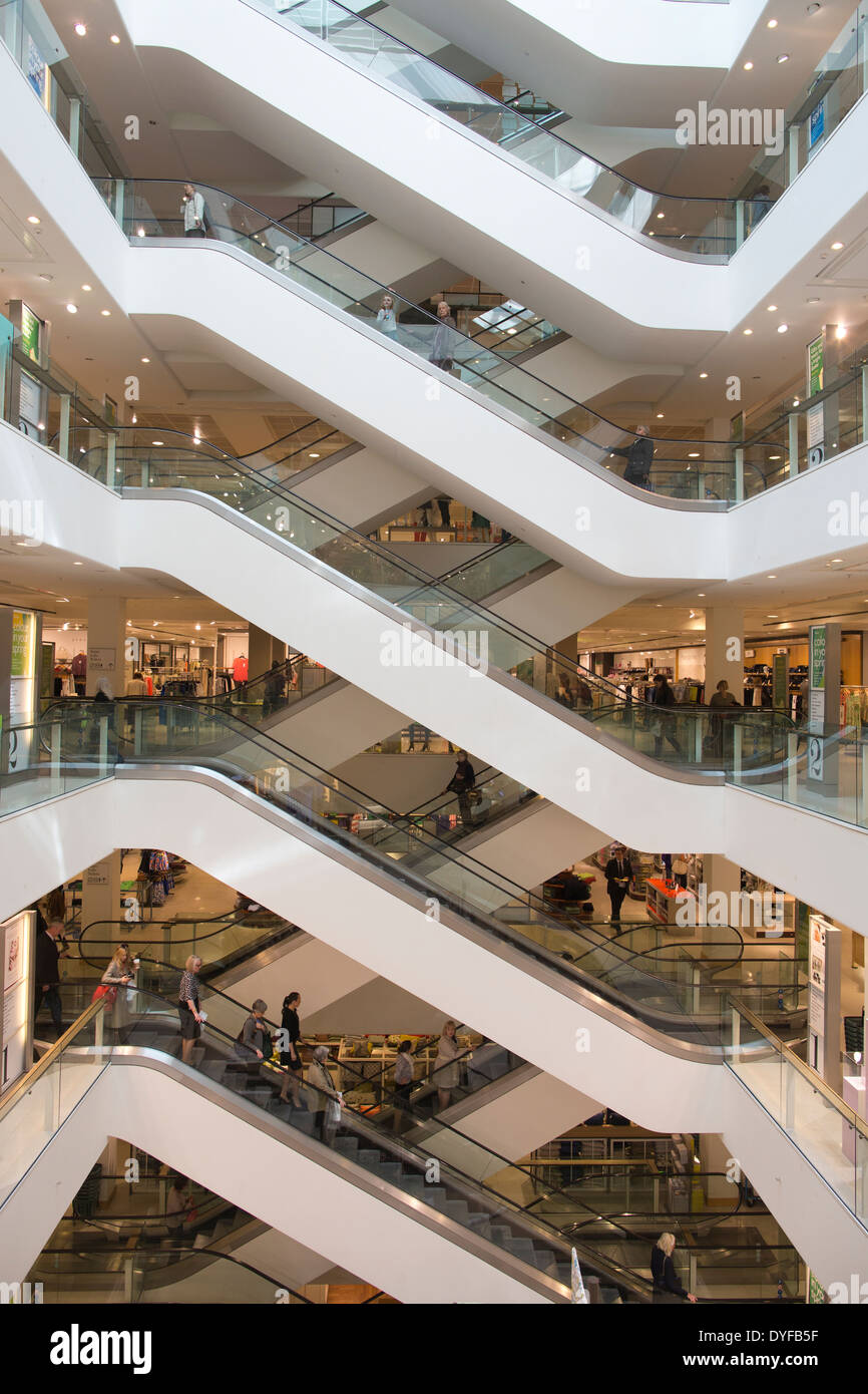 The main escalators in Peter Jones department store owned by John Lewis Partnership, located in Sloane Square, Chelsea London UK Stock Photo