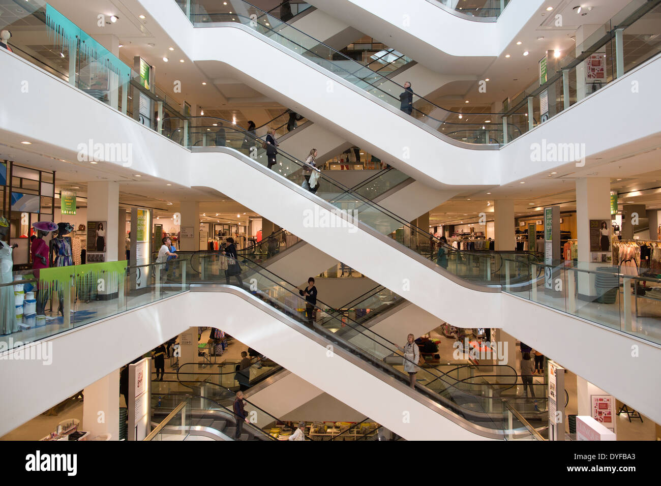 The main escalators in Peter Jones department store owned by John Lewis Partnership, located in Sloane Square, Chelsea London UK Stock Photo