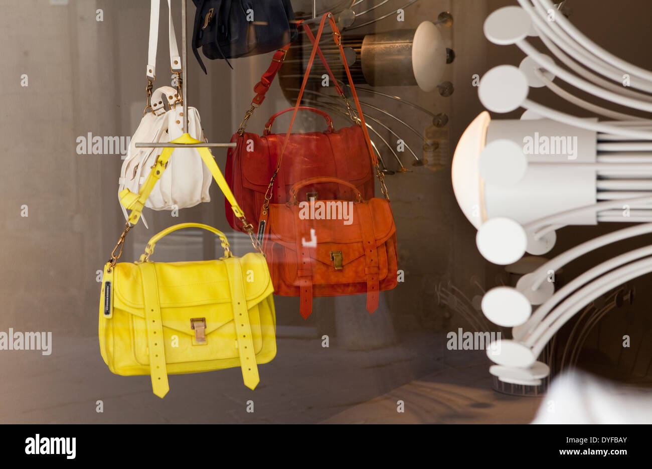Expensive leather hand bags for sale in a shop window in Arezzo, Italy Stock Photo