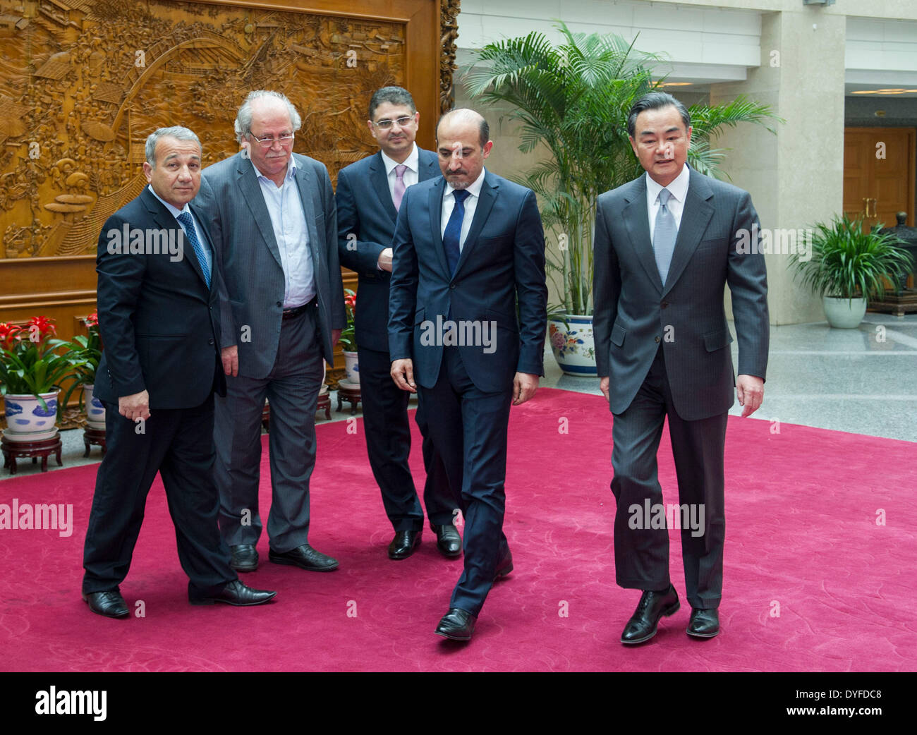 Beijing, China. 16th Apr, 2014. Chinese Foreign Minister Wang Yi (1st R) meets with Jarba (2nd R), head of the National Coalition of Syrian Opposition and Revolutionary Forces, in Beijing, China, April 16, 2014. © Wang Ye/Xinhua/Alamy Live News Stock Photo