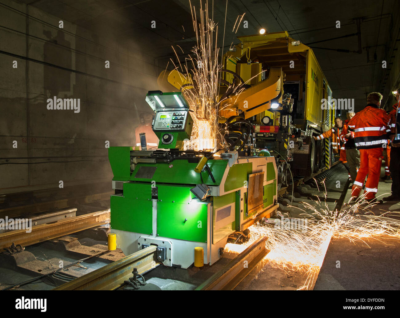 Welding machine welding newly laid railroad tracks in a tunnel near Frankfurt - Germany - April 2014. Stock Photo