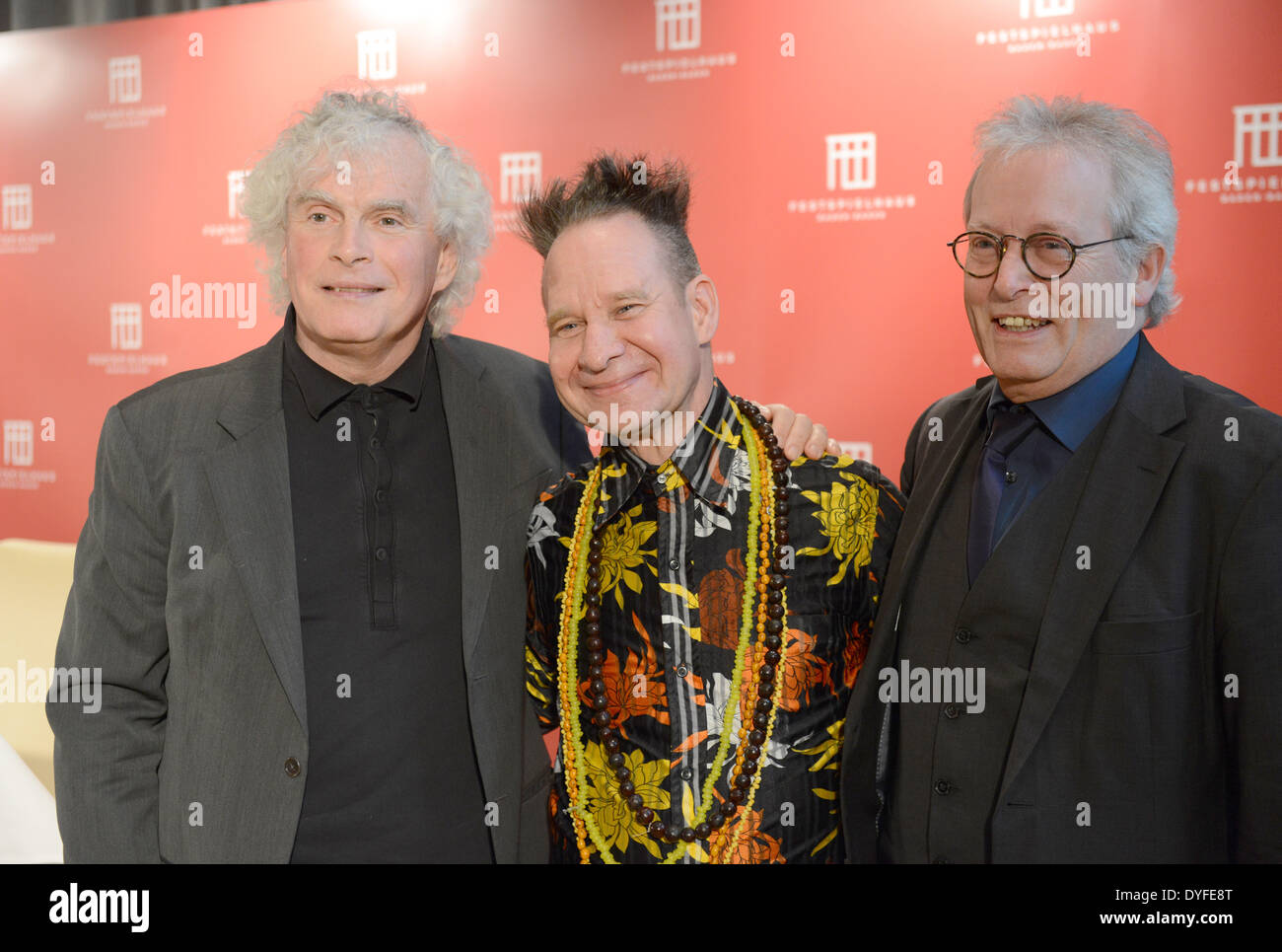 (L-r) Sir Simon Rattle, Peter Sellars, and Andreas Moellich-Zebhauser, are seen on Monday, April 14, 2014, in Baden-Baden, Germany Stock Photo