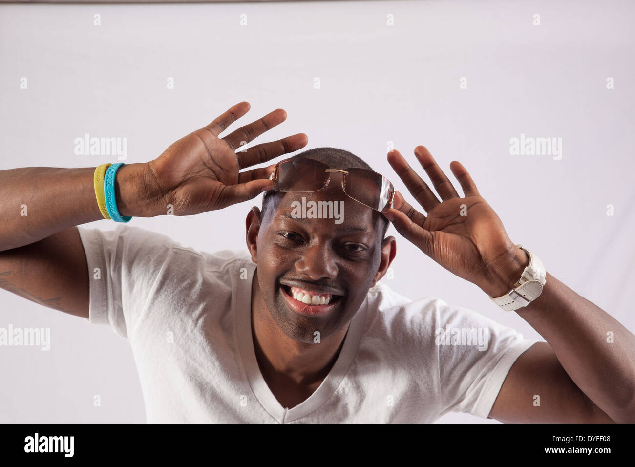 Happy black man white shirt hi-res stock photography and images - Alamy