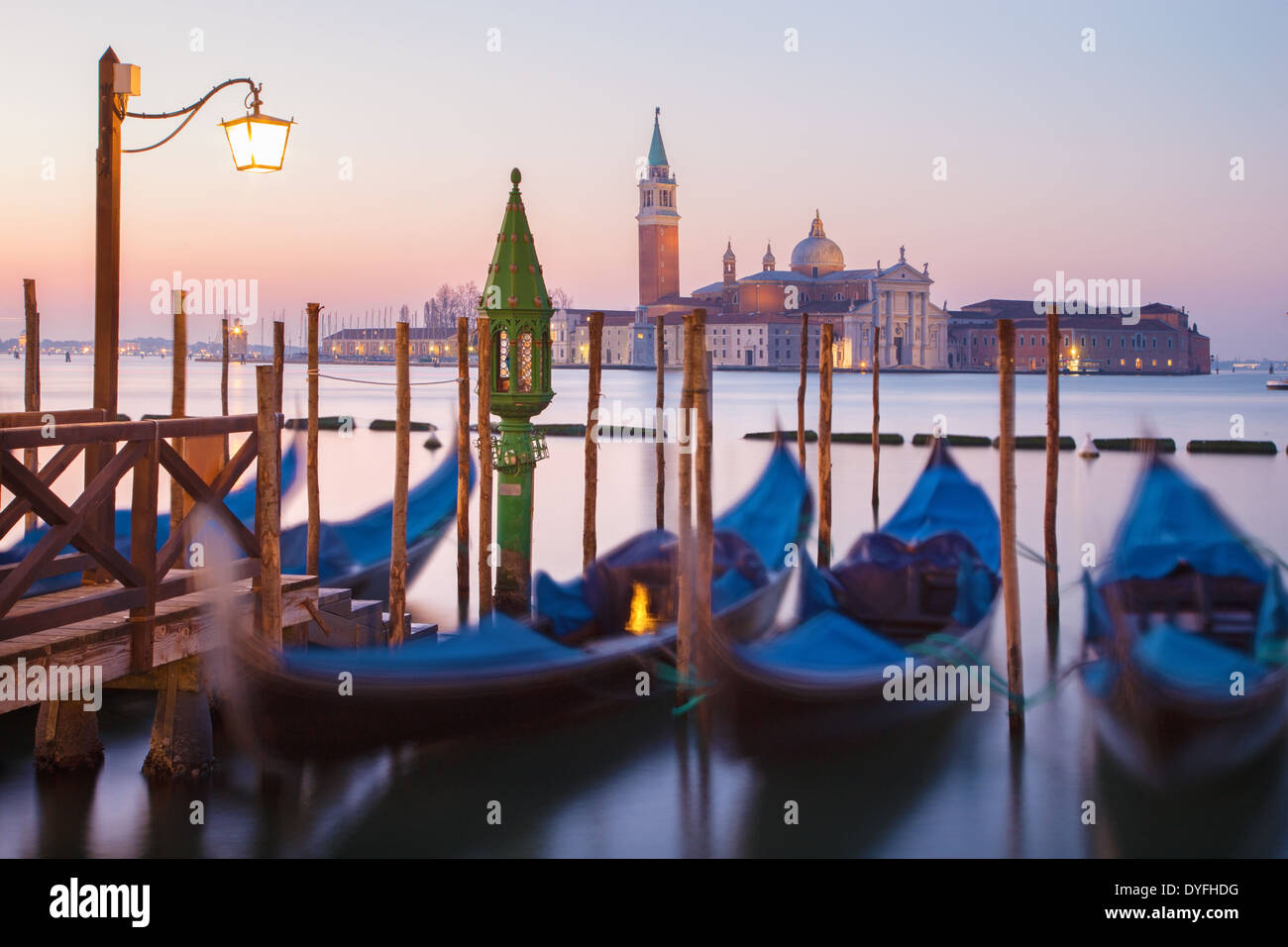 Venice - Gondolas and San Giorgio Maggiore church in background in morning dusk. Stock Photo