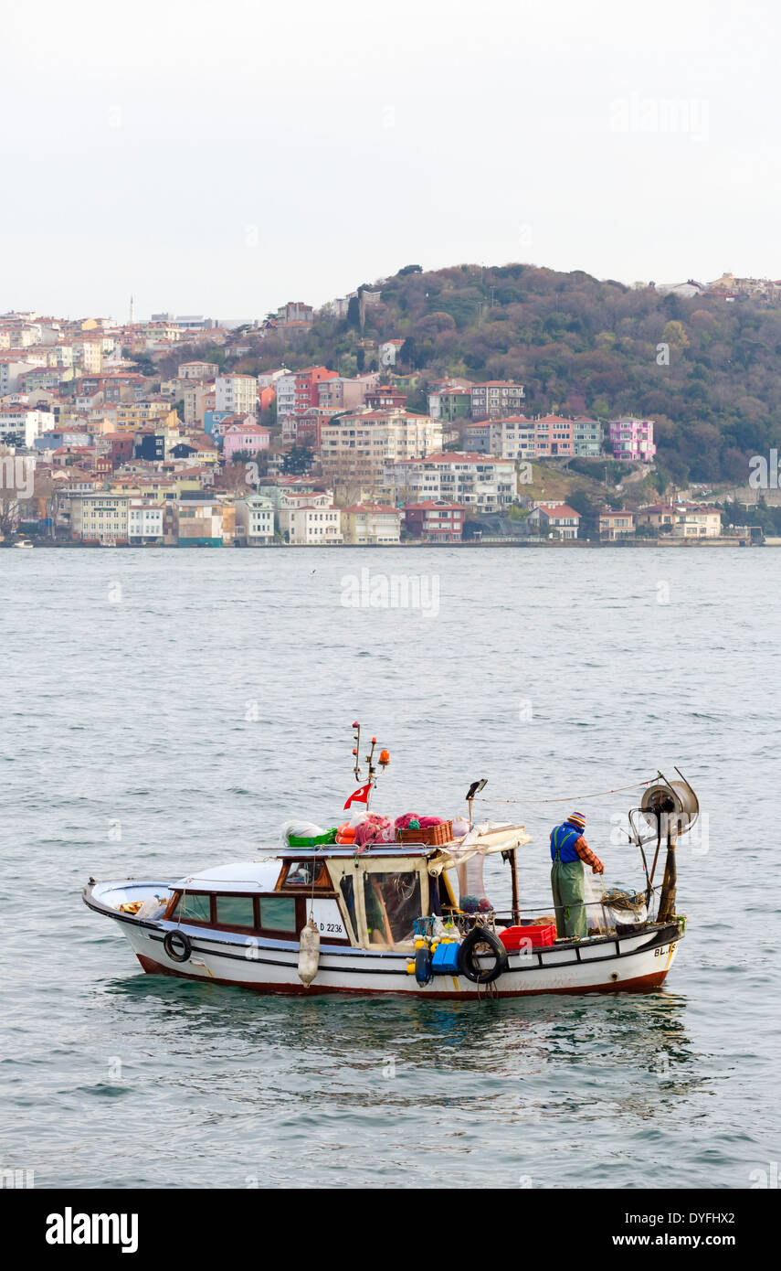Small fishing boat on the Bosphorus, Istanbul, Turkey Stock Photo