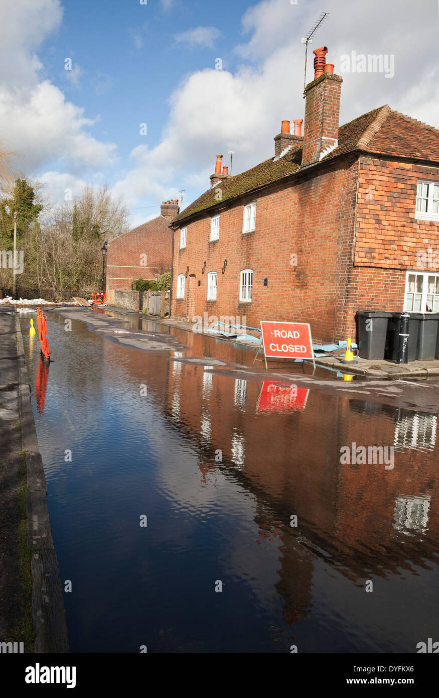 Road Closed sign due to flooding in Water Lane, Winchester Hampshire. Flooding is becoming more frequent with climate change. Stock Photo
