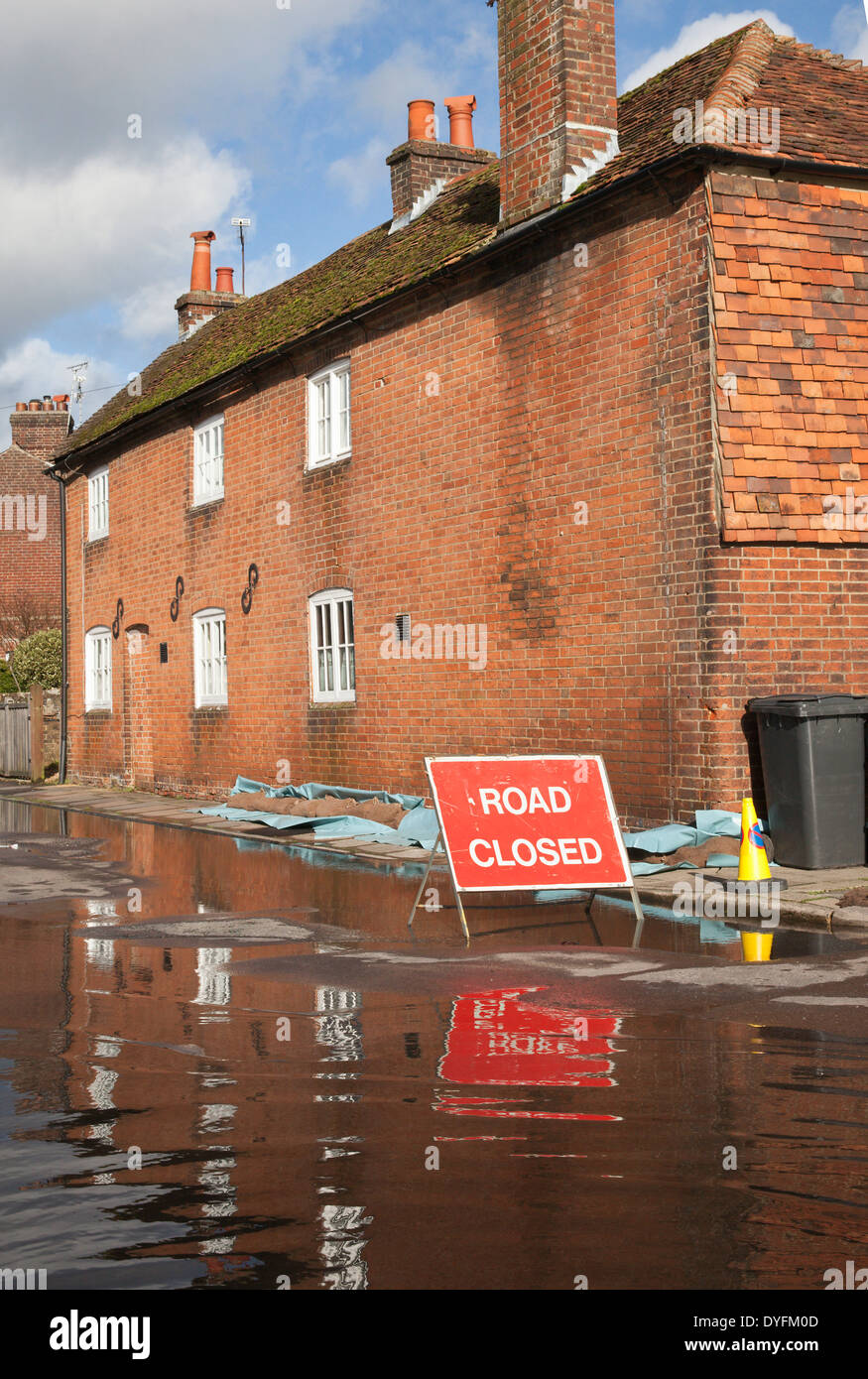 Road Closed sign due to flooding in Water Lane, Winchester Hampshire. Flooding is becoming more frequent with climate change. Stock Photo
