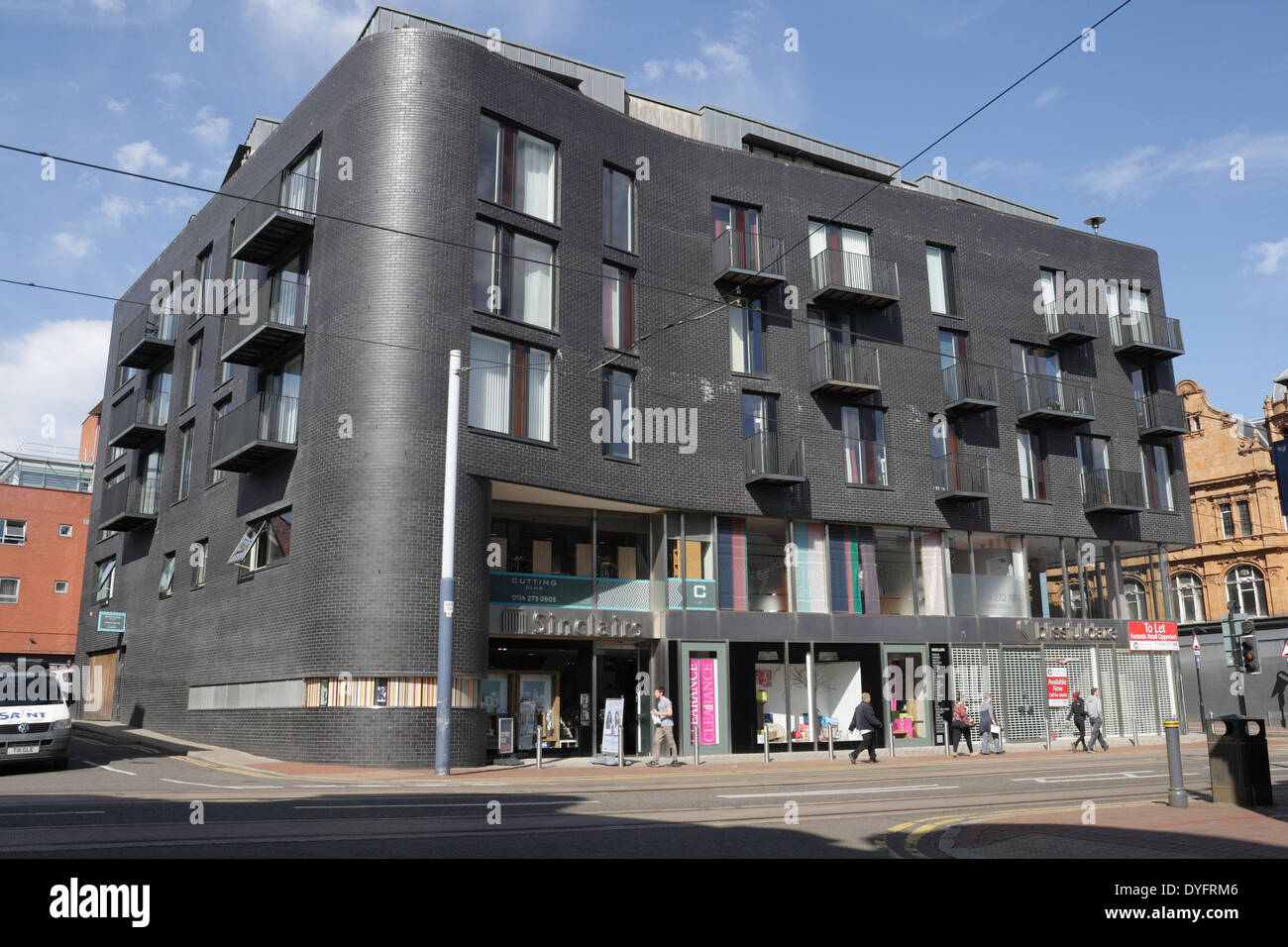 Modern apartment flats building with ground floor shops, West Street