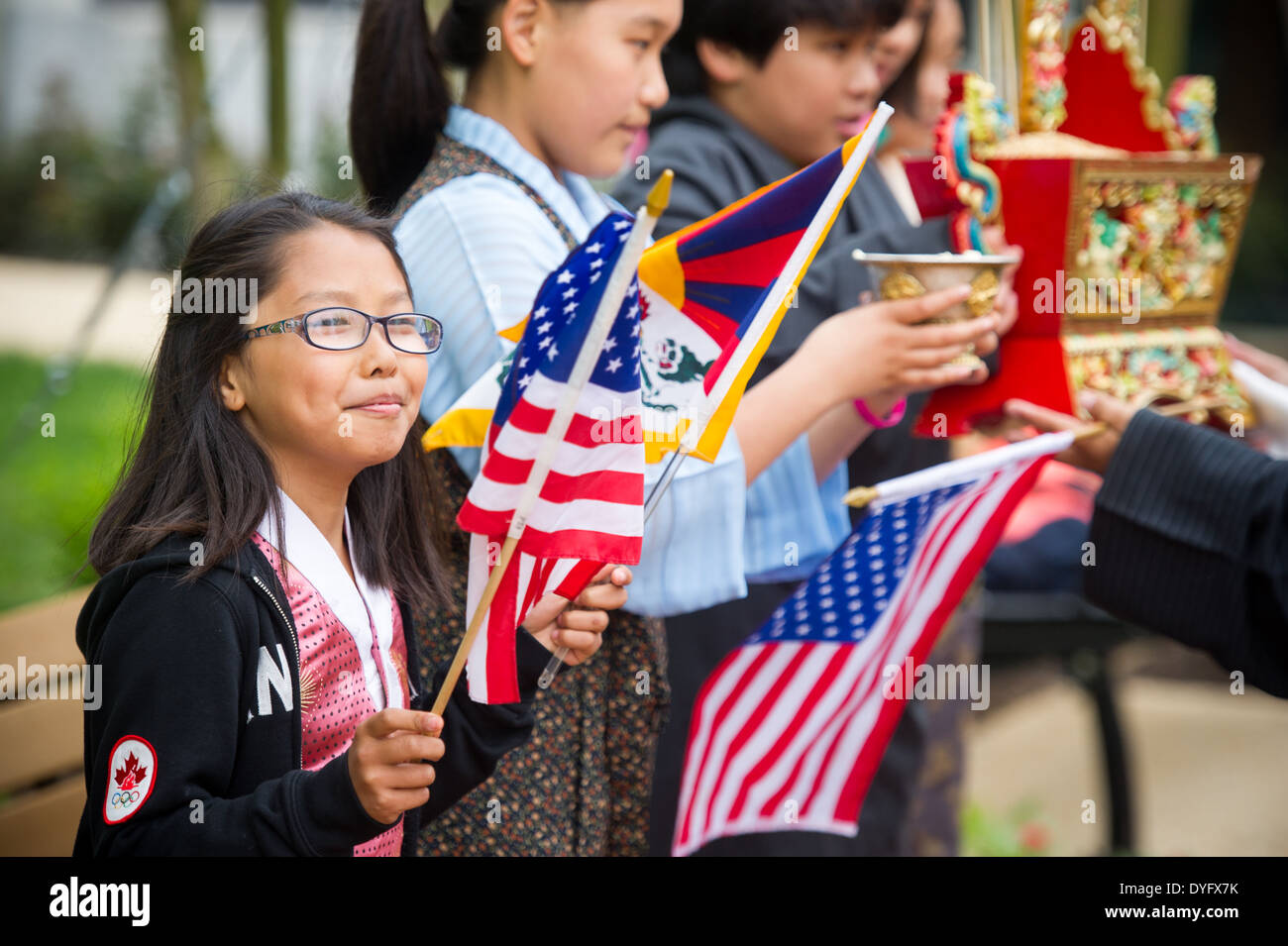 Girls with Tibetan and American Flags Stock Photo
