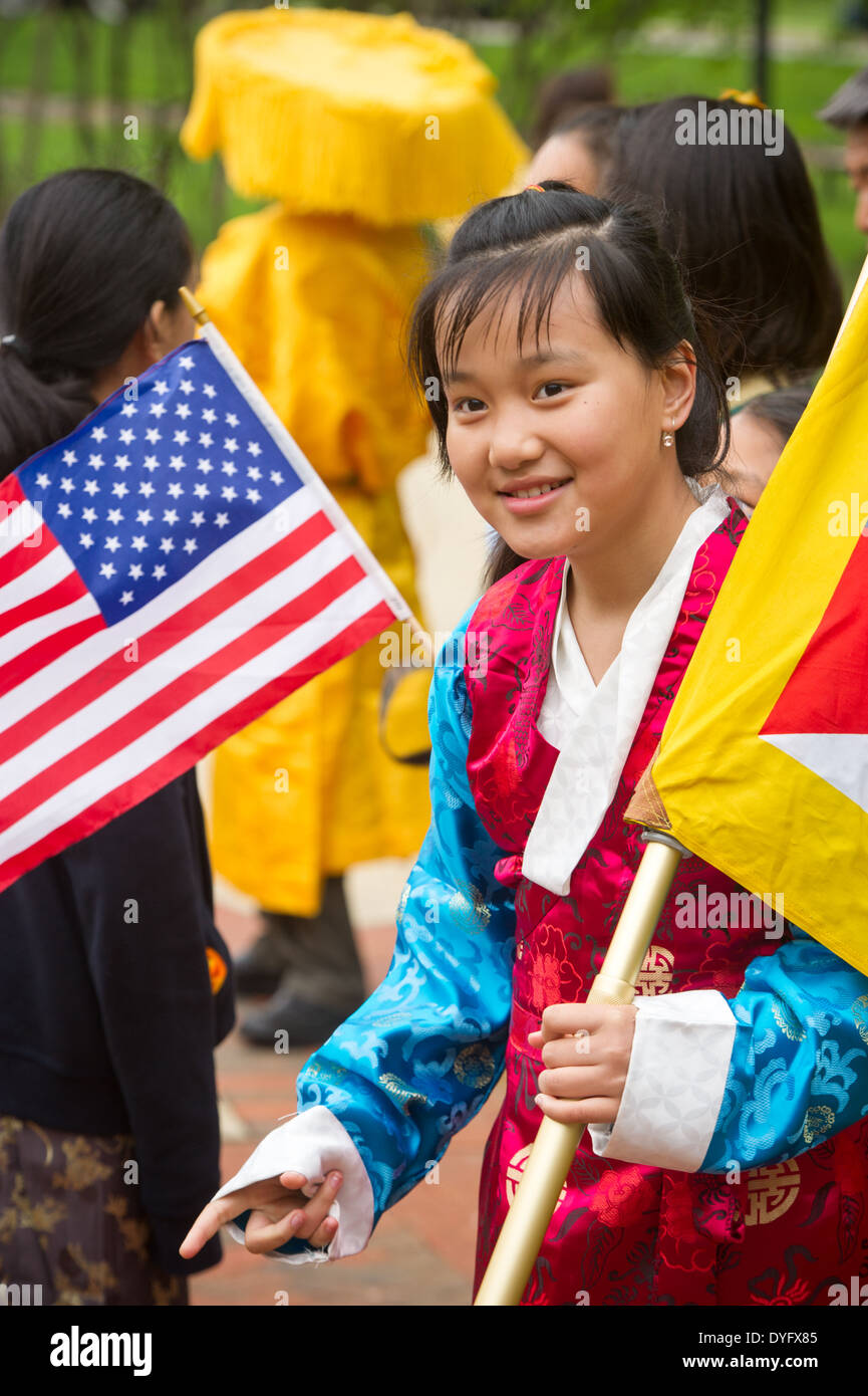 Tibetan girl in traditional dress with Flags Stock Photo