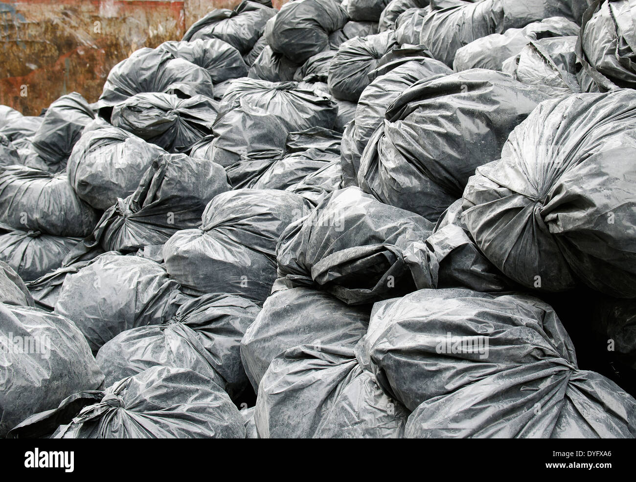 construction garbage bags in dumpster Stock Photo