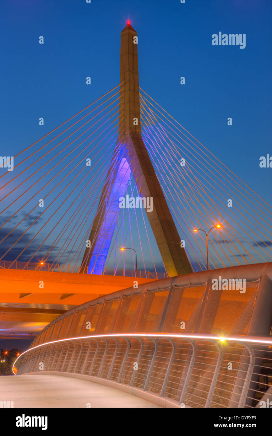 The sky begins to lighten during morning twilight behind one of the suspension towers of the Leonard P. Zakim Bunker Hill Memorial Bridge. Stock Photo