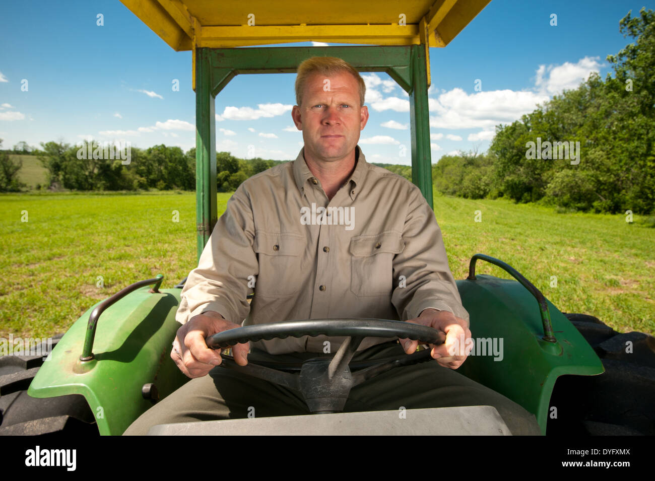 Farmer driving tractor hires stock photography and images Alamy