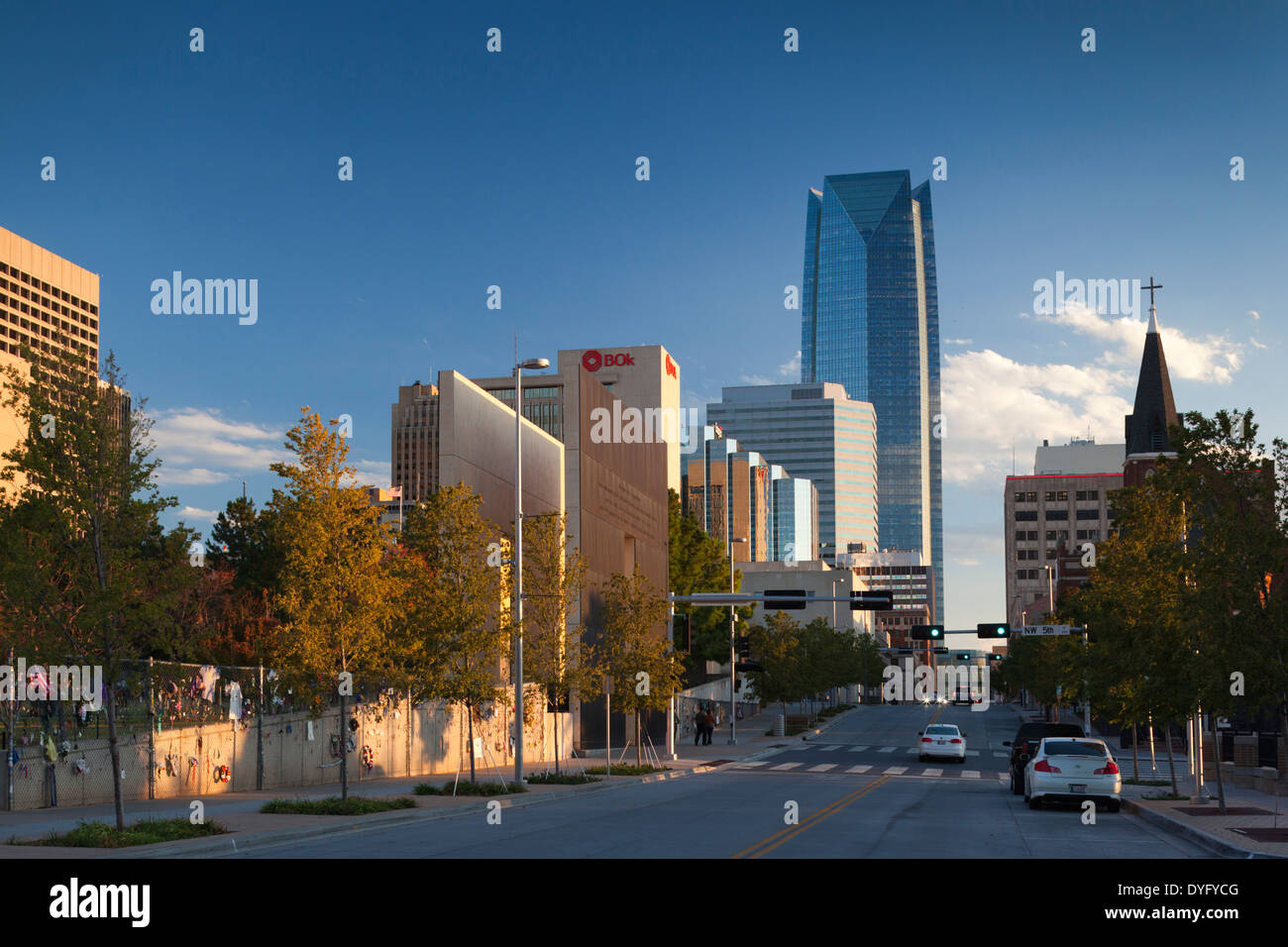 USA, Oklahoma, Oklahoma City, Oklahoma City National Memorial, West Entrance and city skyline Stock Photo