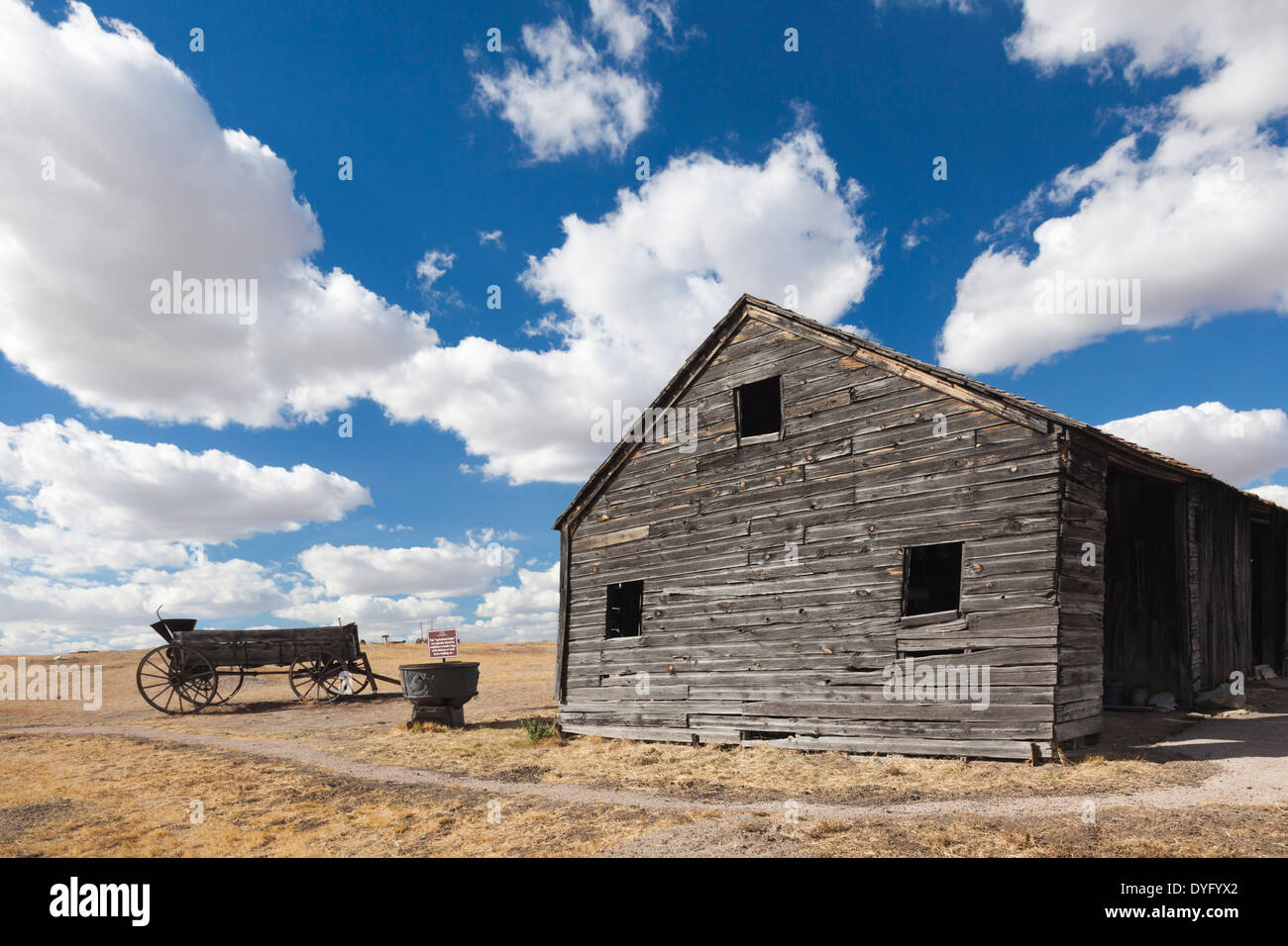 USA, South Dakota, Cactus Flat, Prairie Homestead, old wagon and barn Stock Photo