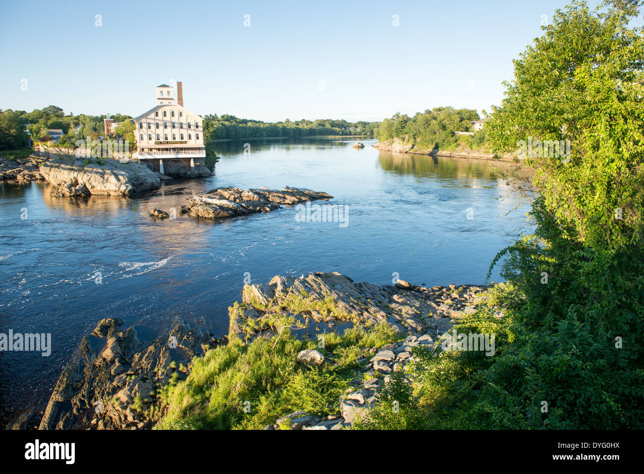 Old restored mill factory building on river Topsham Maine Stock Photo